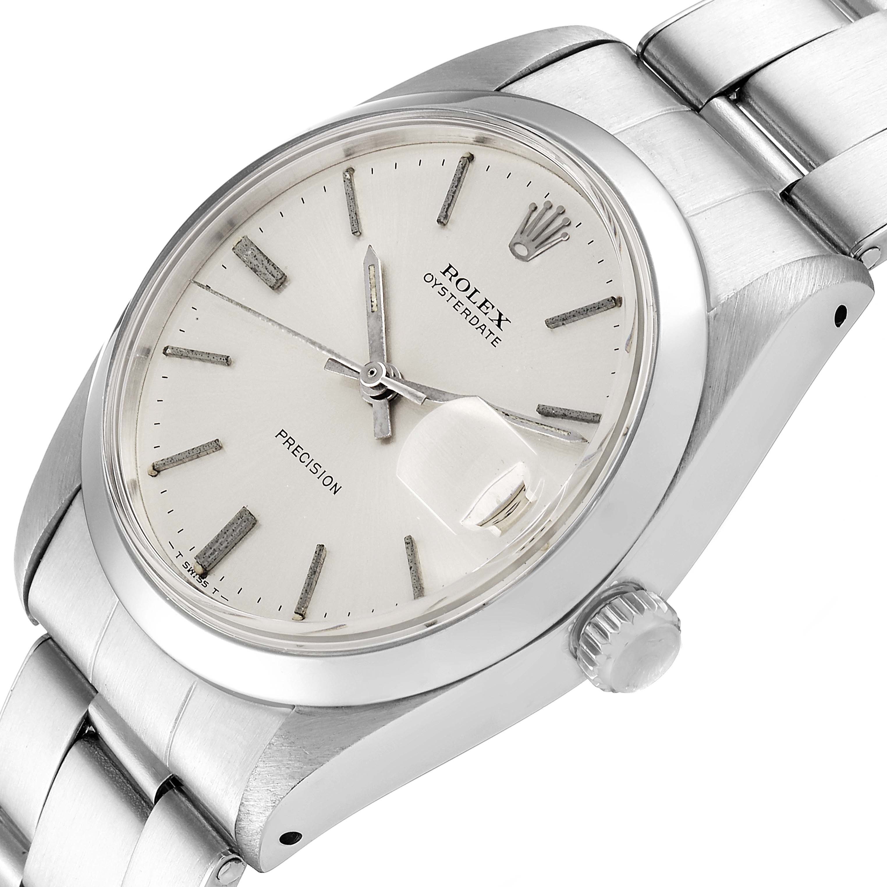 The Vintage Collection Rolex watch is shown at a slight angle, highlighting the dial, crown, and metal bracelet.