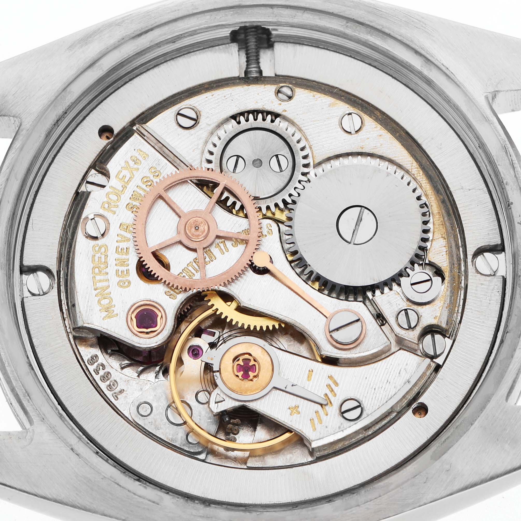 The image shows the open back view of a Rolex Vintage Collection 6694 Men's Stainless Steel Silver Dial watch, revealing its intricate mechanical movement.