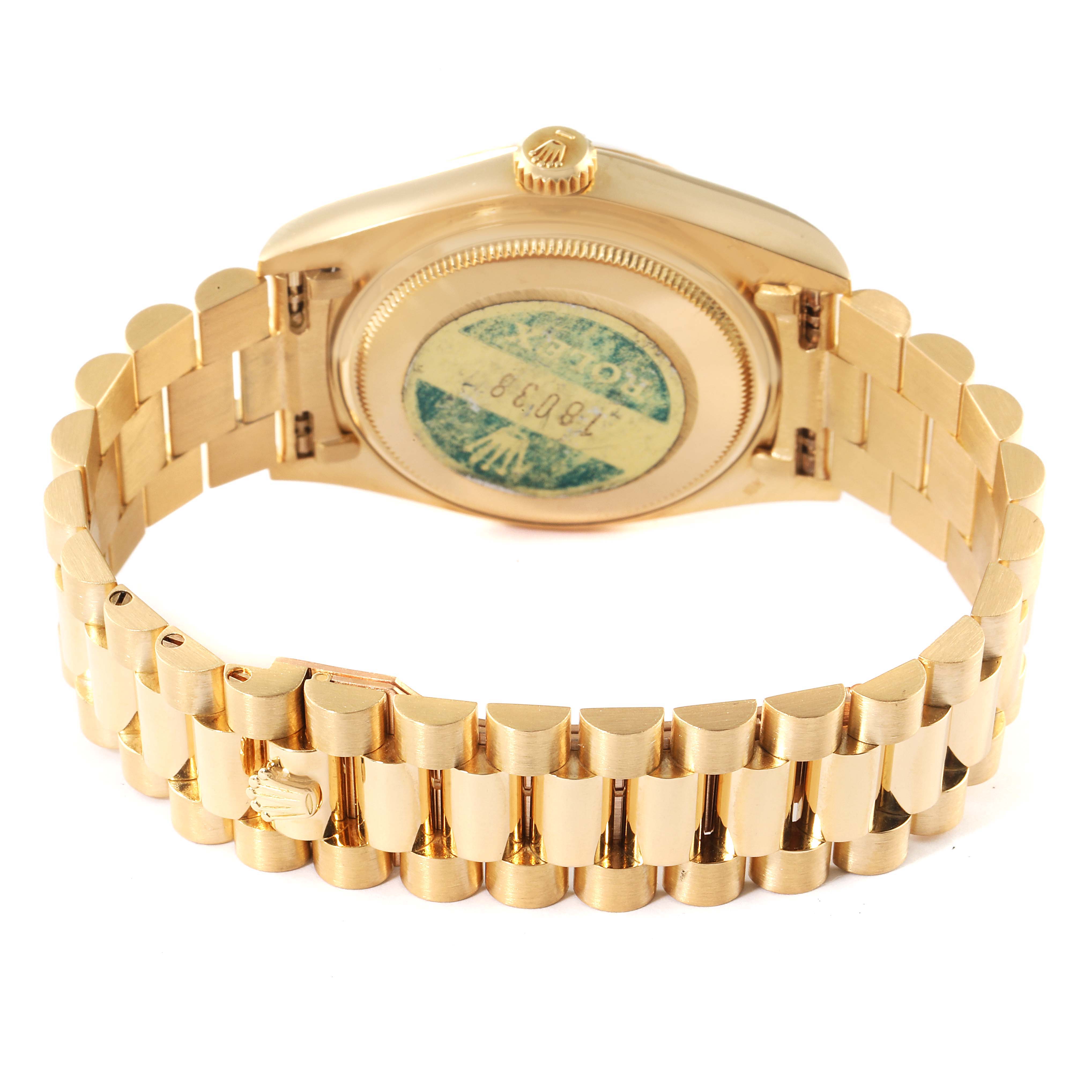 The image shows the back case and bracelet of a Rolex President 18038 Men
s Yellow Gold Champagne Dial 18038 Men
s Yellow Gold Champagne Dial model watch at a slight angle.