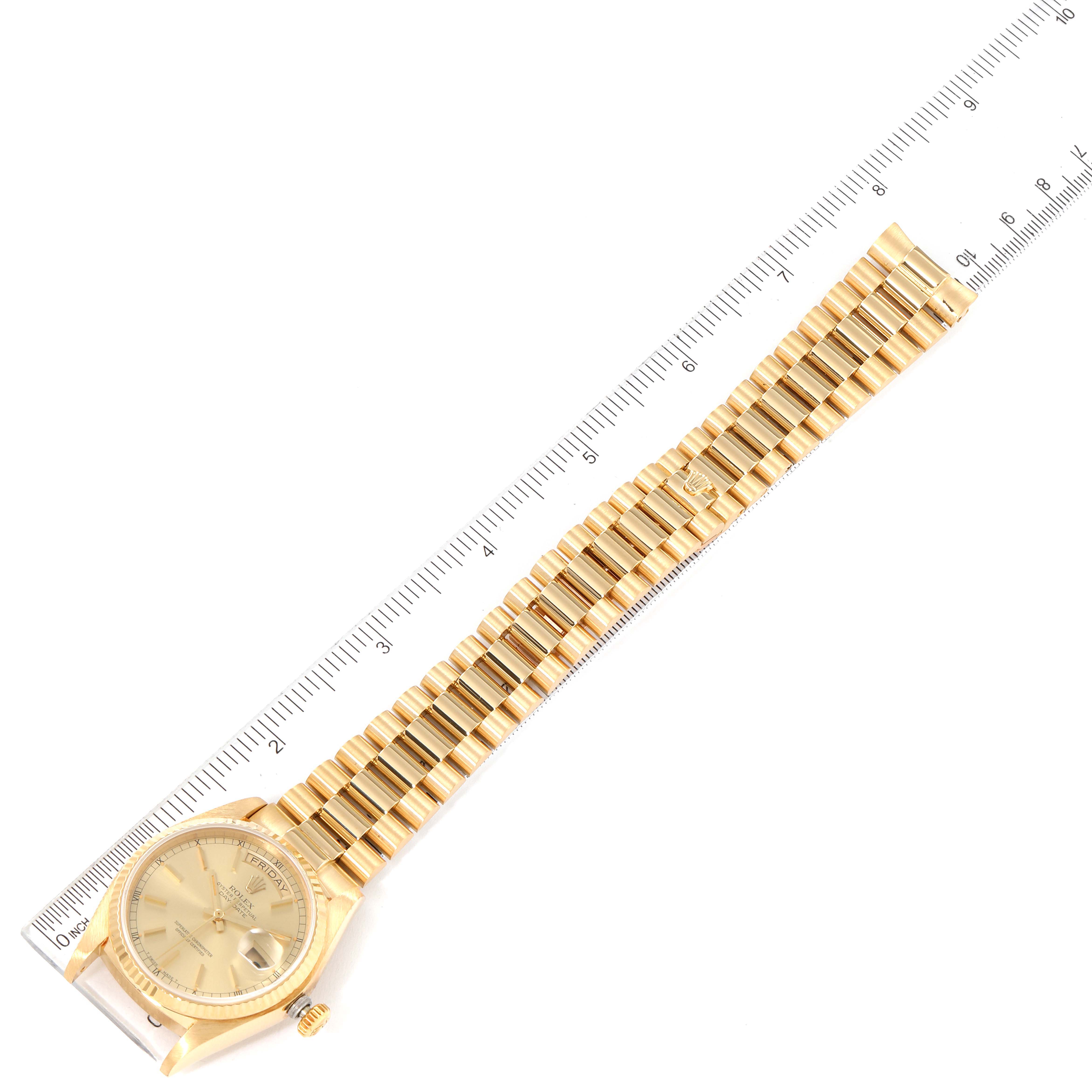 The image shows a Rolex President 18038 Men
s Yellow Gold Champagne Dial 18038 Men
s Yellow Gold Champagne Dial model watch laid flat along a ruler, displaying its full length from the dial to the bracelet.