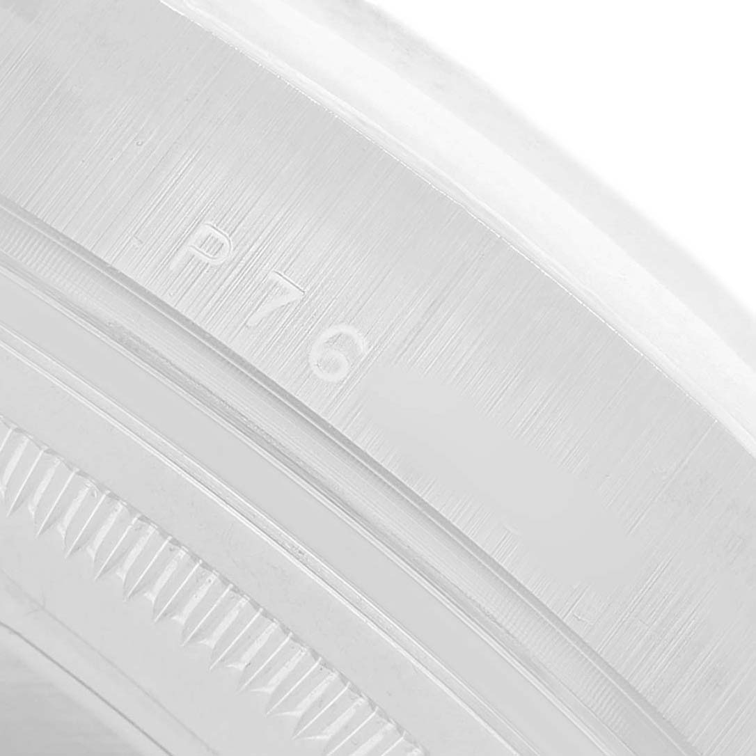 The image shows a close-up of the Rolex President 118209 Men's White Gold Silver Dial model's bezel and case edge.