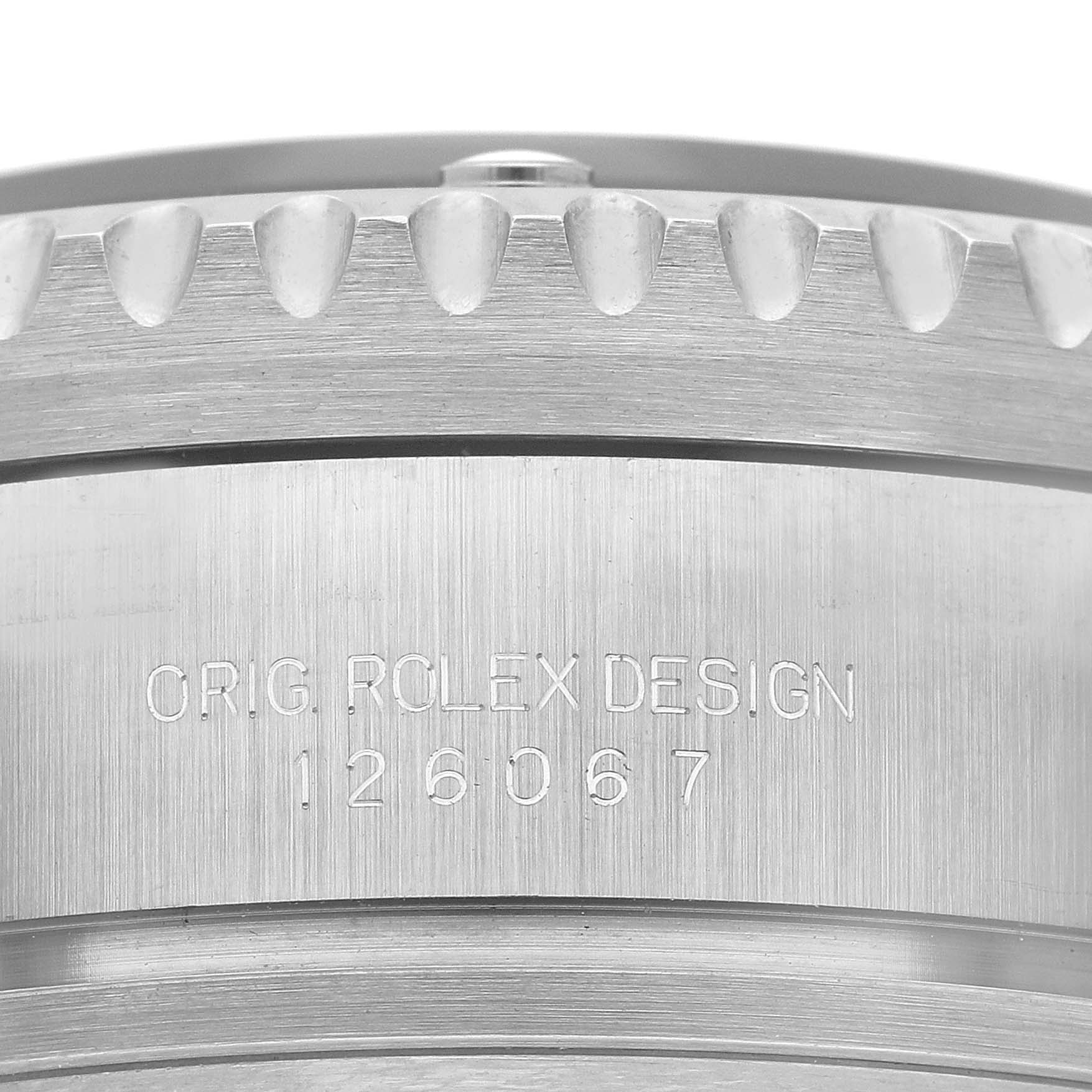 The image shows the side view of the Rolex Sea-Dweller 126067 Men's Titanium Black Dial's textured bezel and engraved serial number.