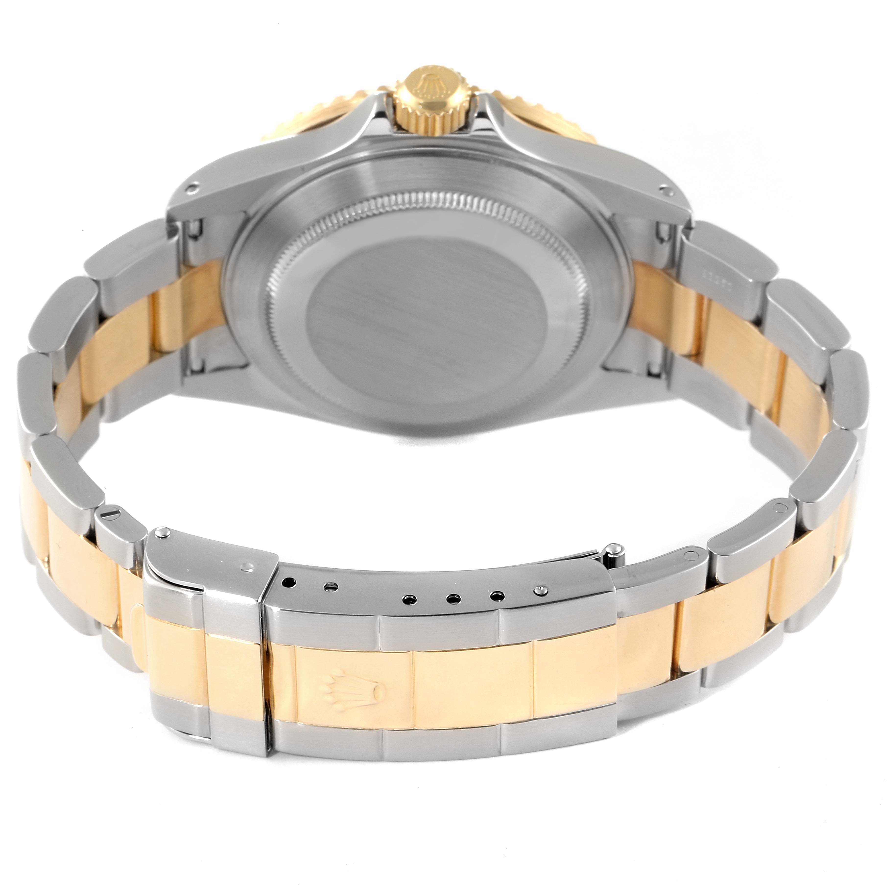 The image shows the back of the Rolex Submariner 16613 Men's Steel and Gold (two tone) Blue Dial 16613 Men's Steel and Gold (two tone) Blue Dial watch, including the case back and bracelet.