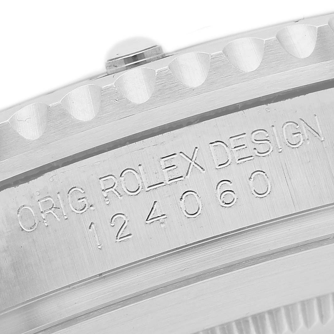The image shows a close-up of the side of a Rolex Submariner 124060 Men's Stainless Steel Black Dial, highlighting the engraved model number.