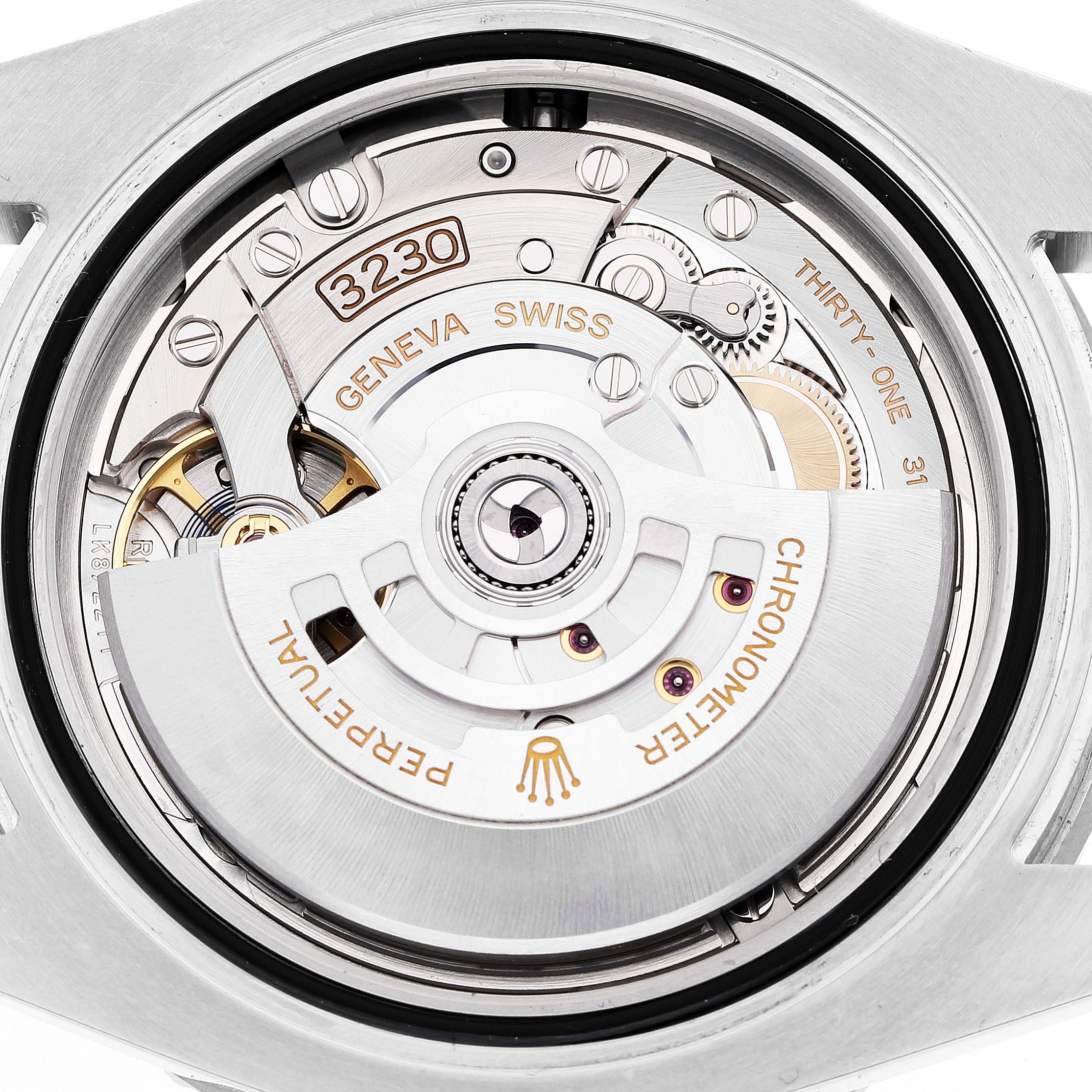 The image shows the movement of a Rolex Submariner 124060 Men's Stainless Steel Black Dial watch from a top-down angle, highlighting the rotor and intricate gears.