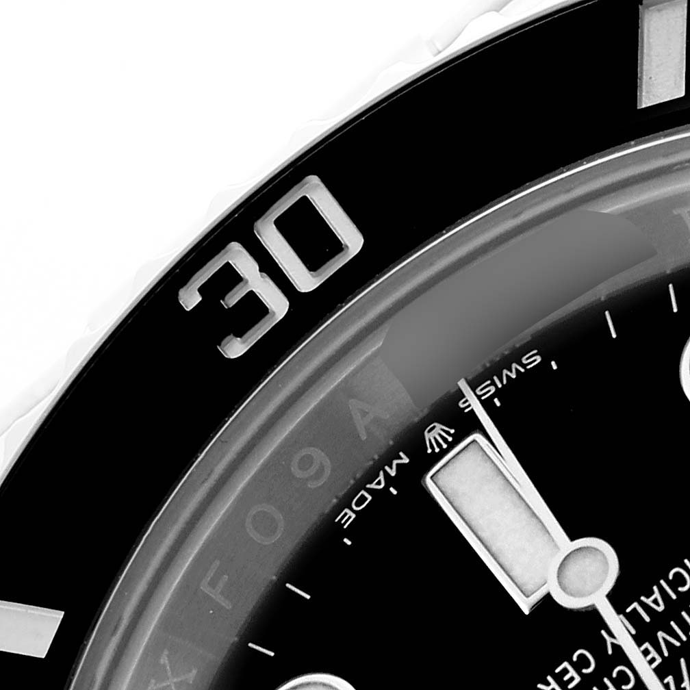 The image shows a close-up of the bezel and part of the dial of a Rolex Submariner 126610LN Men's Stainless Steel Black Dial, highlighting the "30" marker and hour hand.