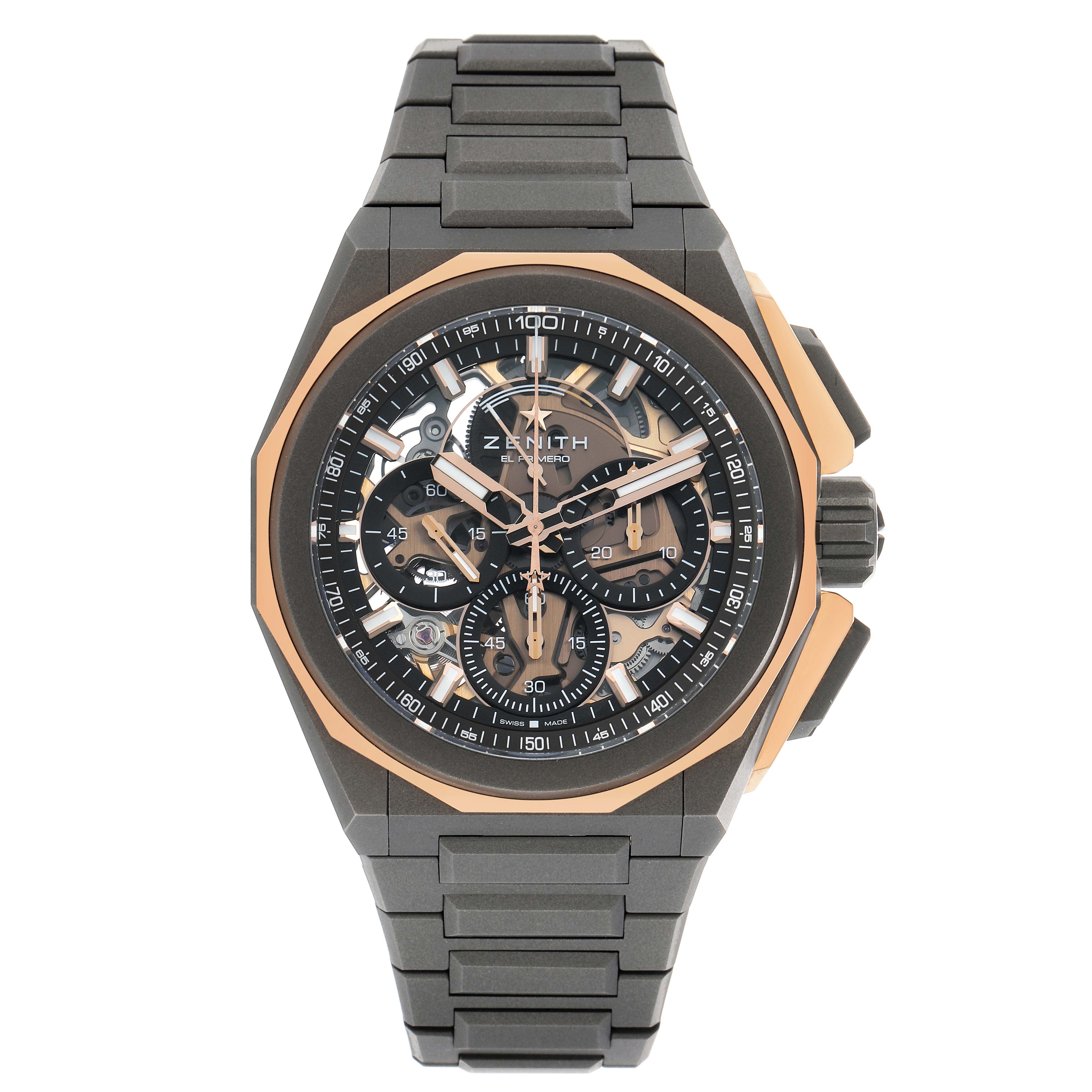 The Zenith Defy 87.9100.9004/03.I001 Men's Titanium Grey Dial watch is shown from a front angle, highlighting its skeleton dial and metal bracelet.