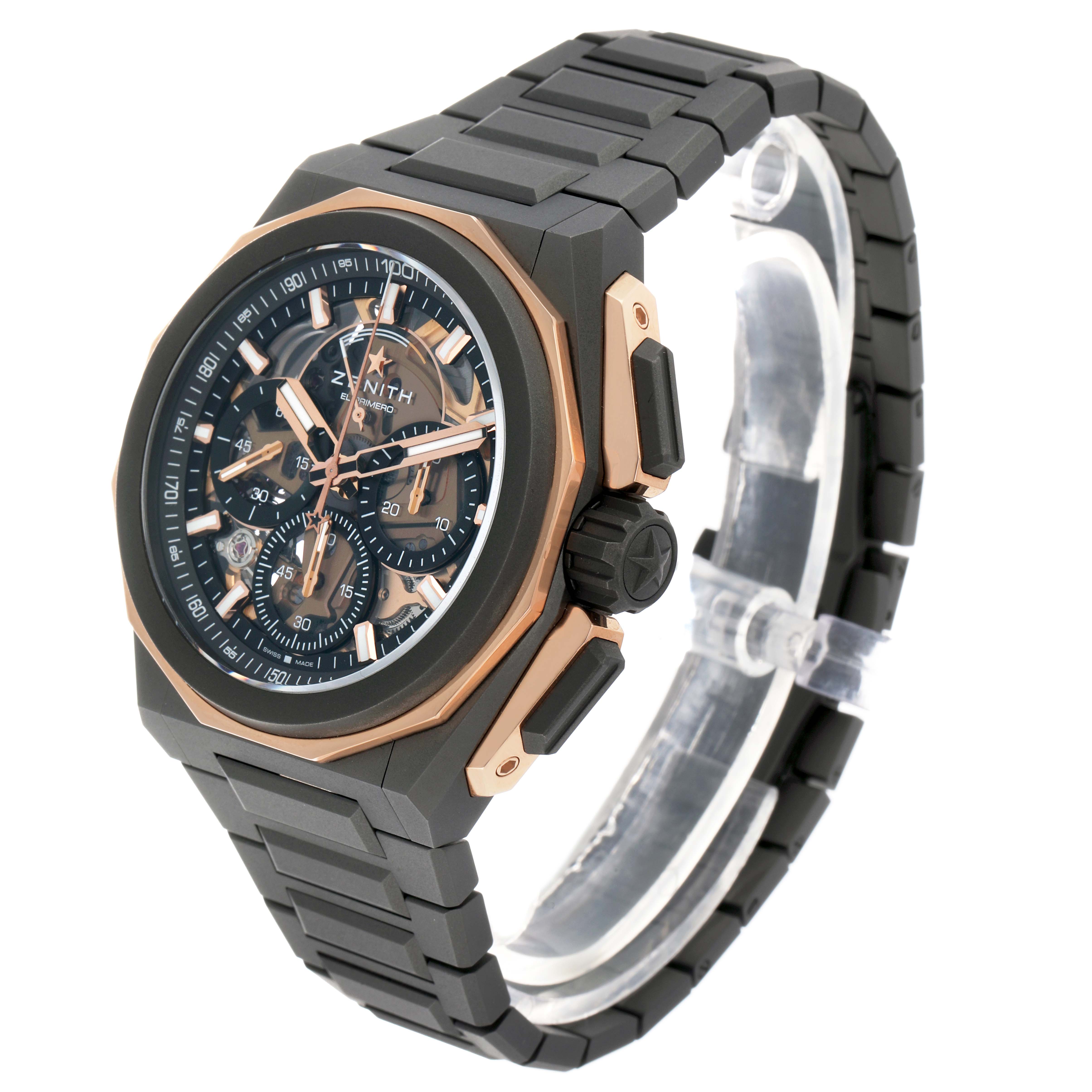 The Zenith Defy 87.9100.9004/03.I001 Men's Titanium Grey Dial watch is shown at an angle highlighting the face, side buttons, and bracelet.