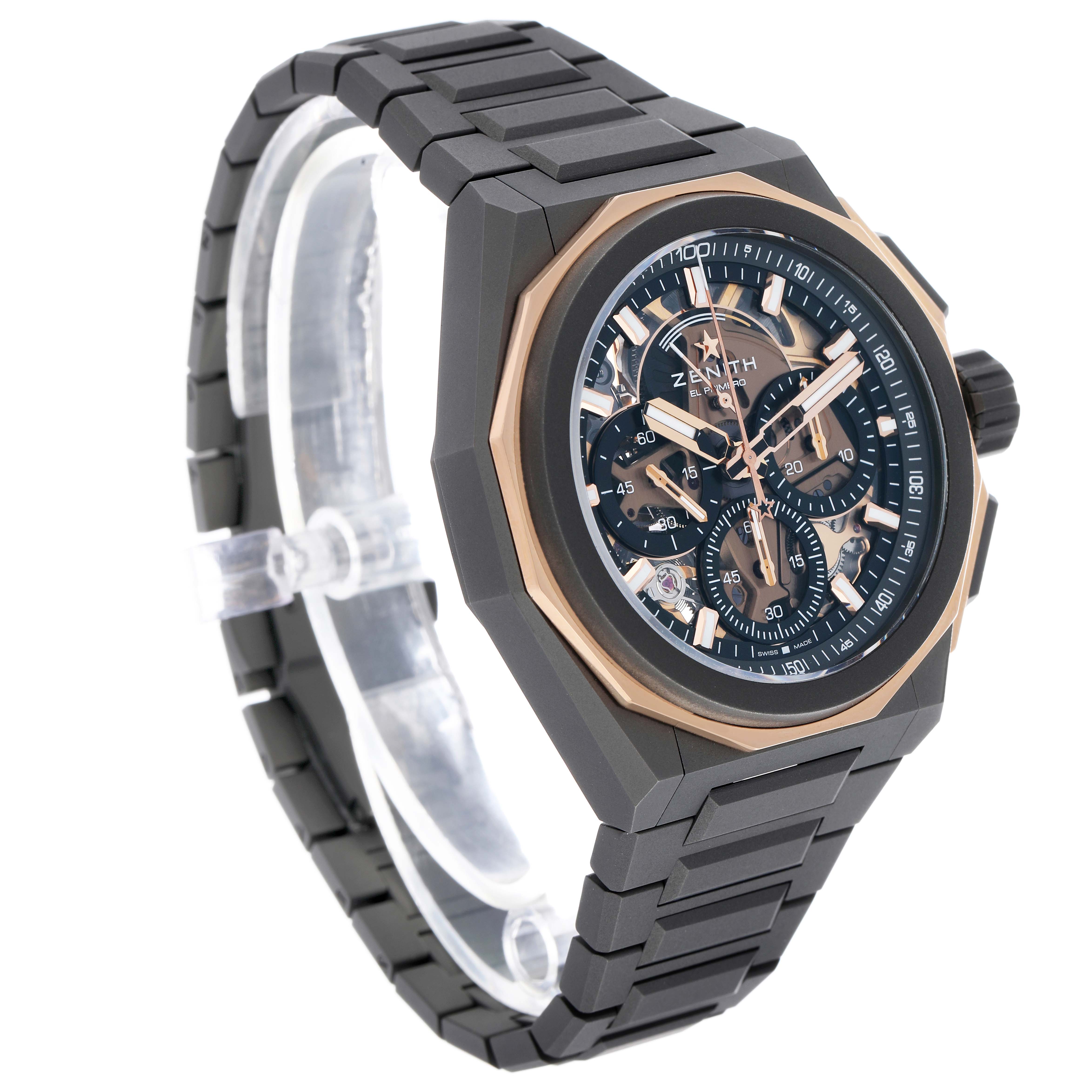 The Zenith Defy 87.9100.9004/03.I001 Men's Titanium Grey Dial watch is shown at a three-quarter angle, highlighting the case, bracelet, and intricate dial.