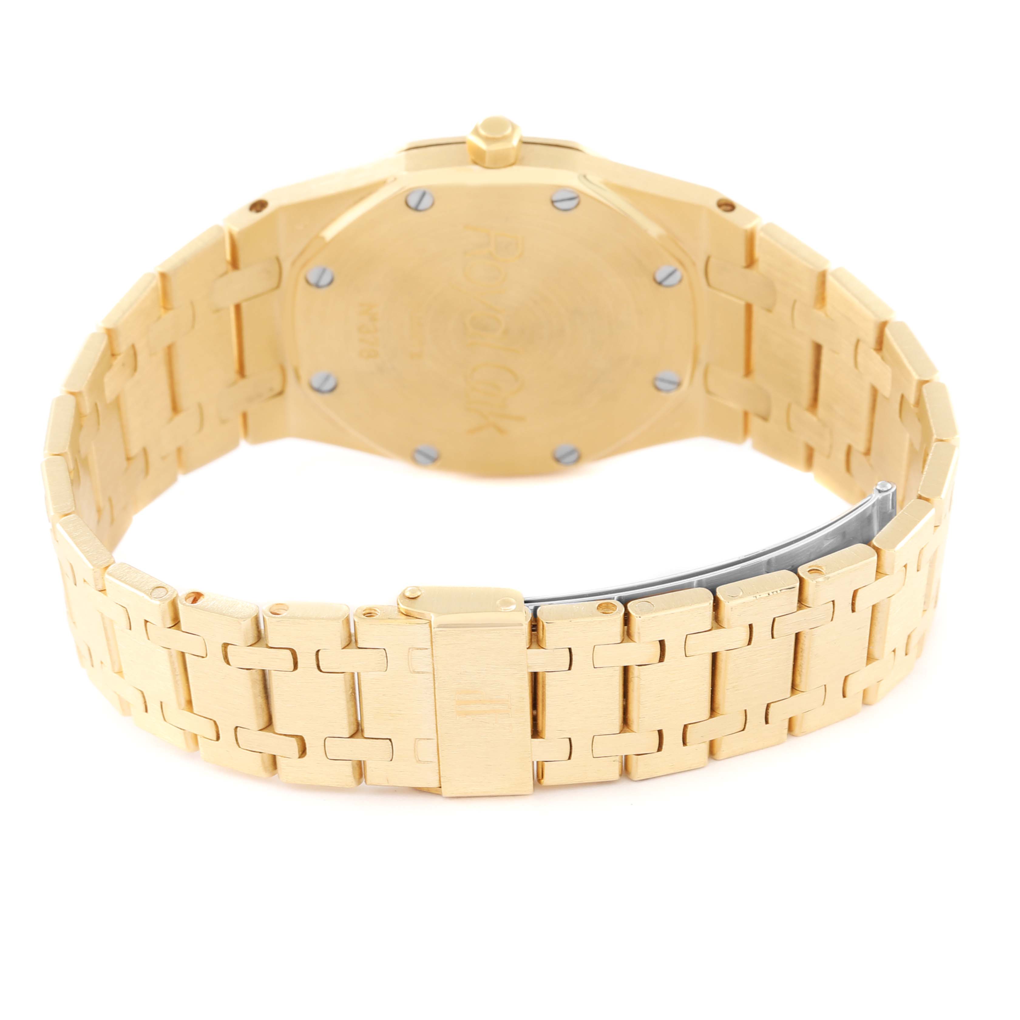 The image shows the back and partially open clasp of an Audemars Piguet Royal Oak 56175BA Men's Yellow Gold White Dial 56175BA Men's Yellow Gold White Dial watch, highlighting its gold bracelet and caseback.