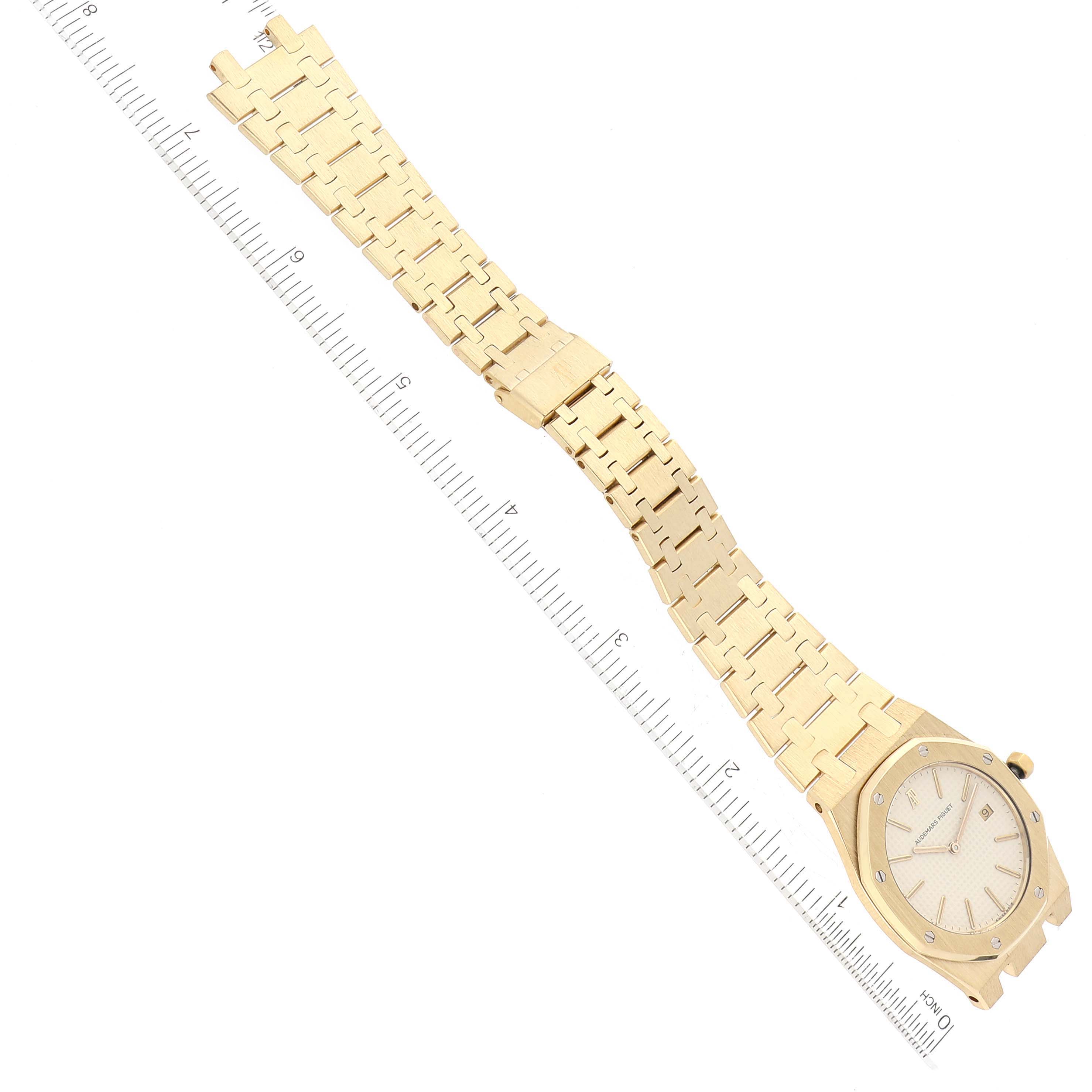 The image shows an Audemars Piguet Royal Oak 56175BA Men's Yellow Gold White Dial 56175BA Men's Yellow Gold White Dial watch at an angled top-down view, highlighting the watch face and full length of the bracelet.