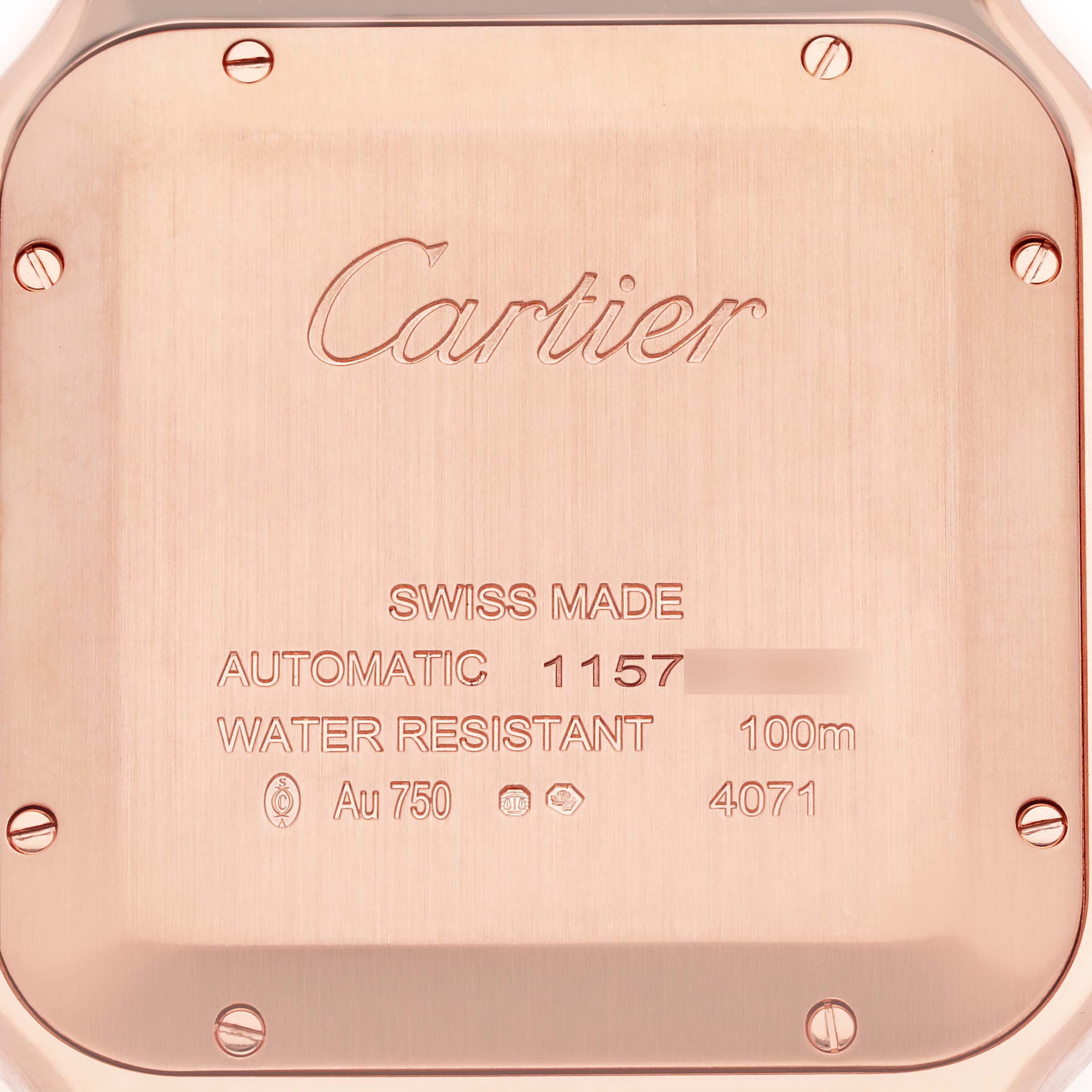 The image shows the back case of a Cartier Santos WGSA0018 Men's Rose Gold Silver Dial WGSA0018 Men's Rose Gold Silver Dial watch, revealing engravings and screws.