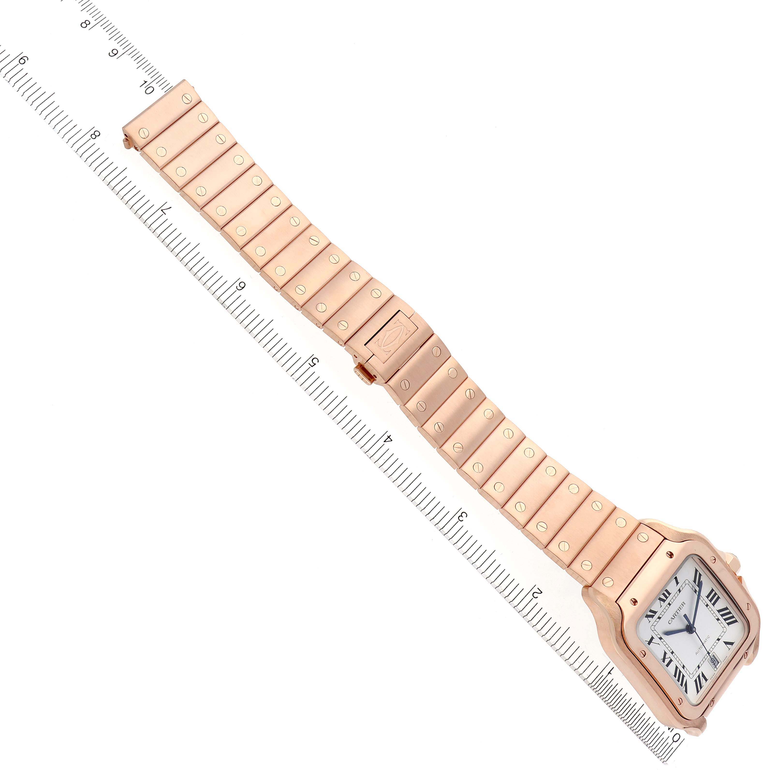 The image shows a Cartier Santos WGSA0018 Men's Rose Gold Silver Dial WGSA0018 Men's Rose Gold Silver Dial watch at a top-down angle, displaying the full bracelet and face alongside a measuring ruler.