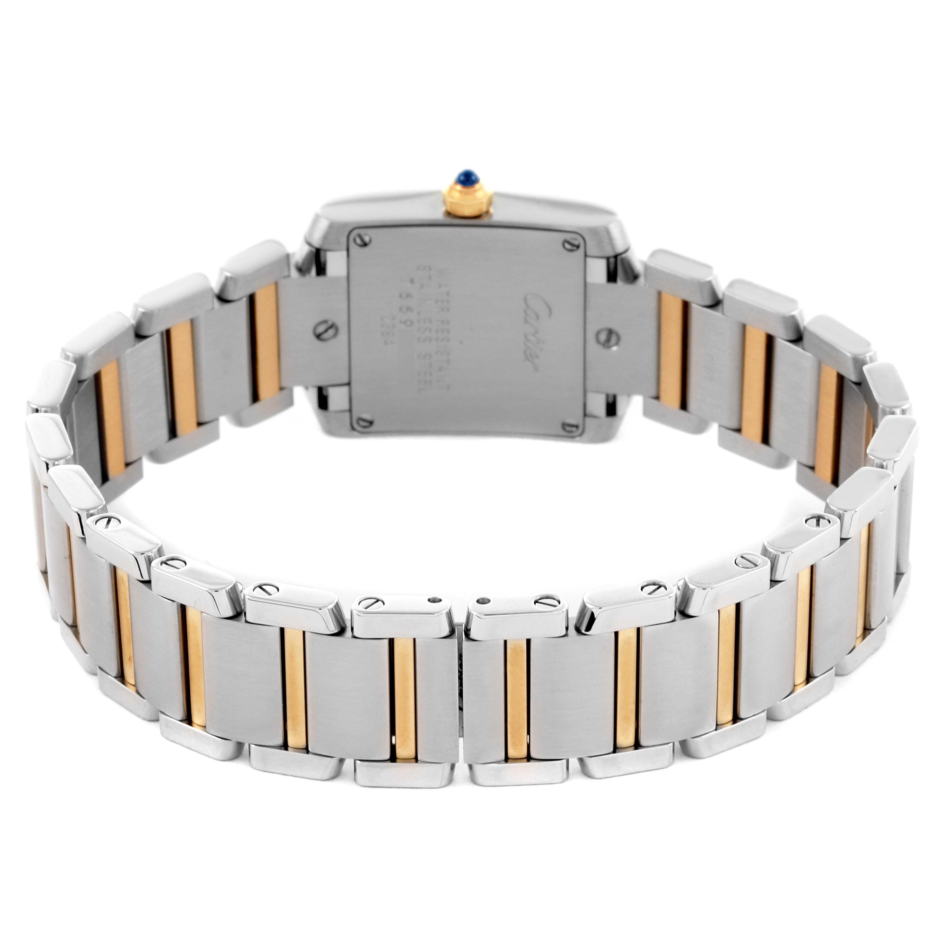 The image shows the back view of the Cartier Tank Française watch, highlighting the case back and two-tone bracelet.