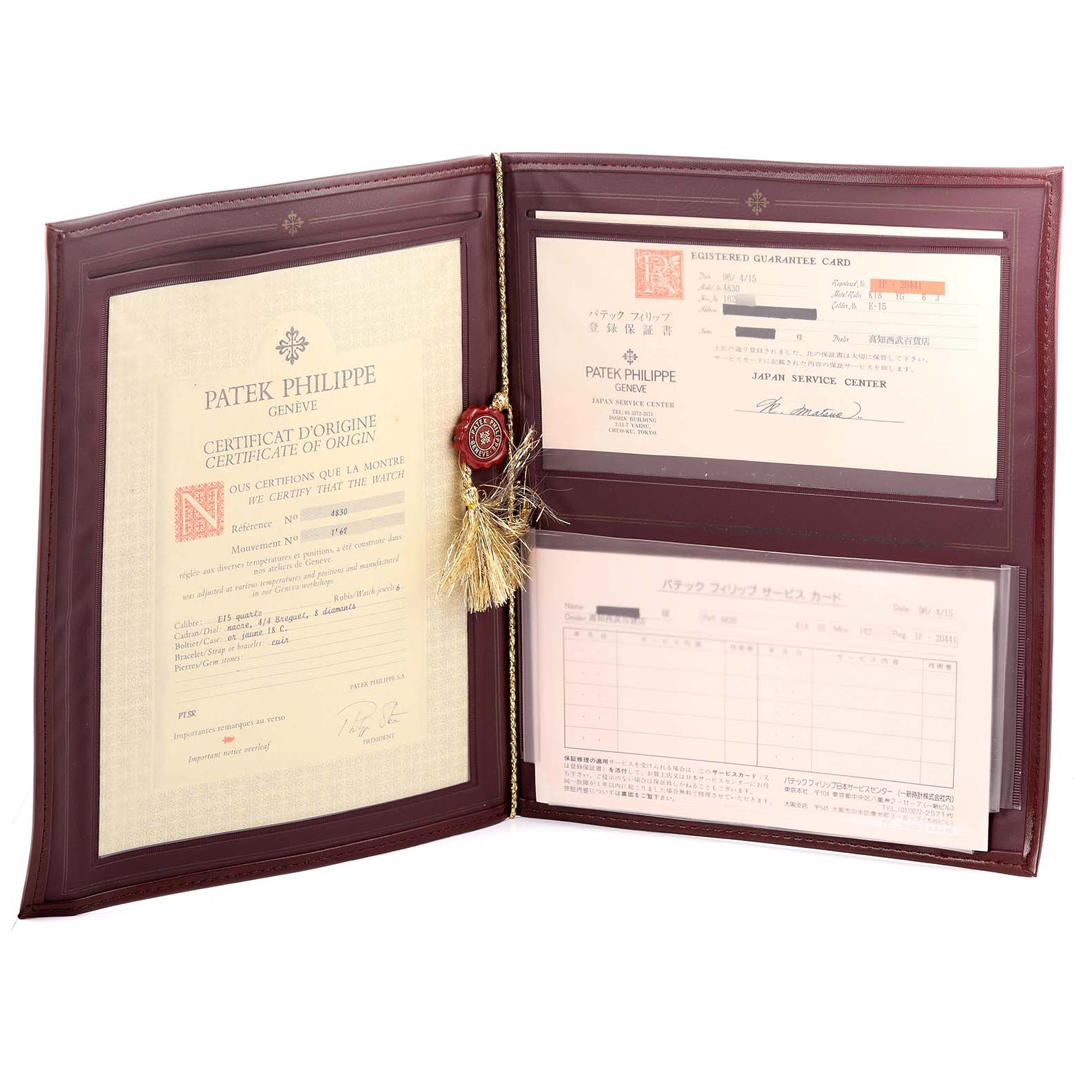 The Golden Ellipse by Patek Philippe is displayed with certificates and guarantee documents in a leather folder.