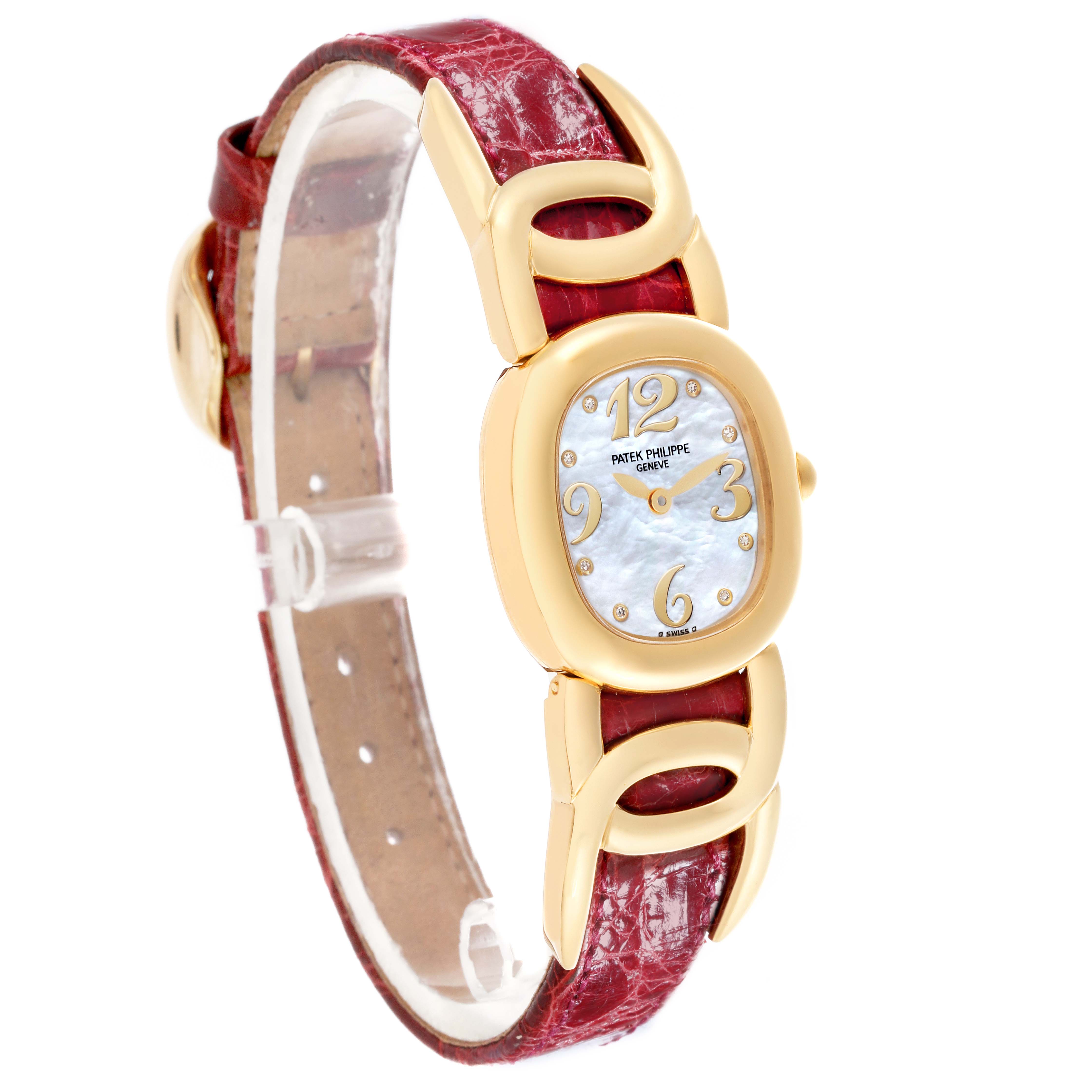 The Patek Philippe Golden Ellipse 4830J Women's Yellow Gold Mother of Pearl Dial 4830J Women's Yellow Gold Mother of Pearl Dial watch is shown at an angled side view, highlighting the case, dial, strap, and lugs.