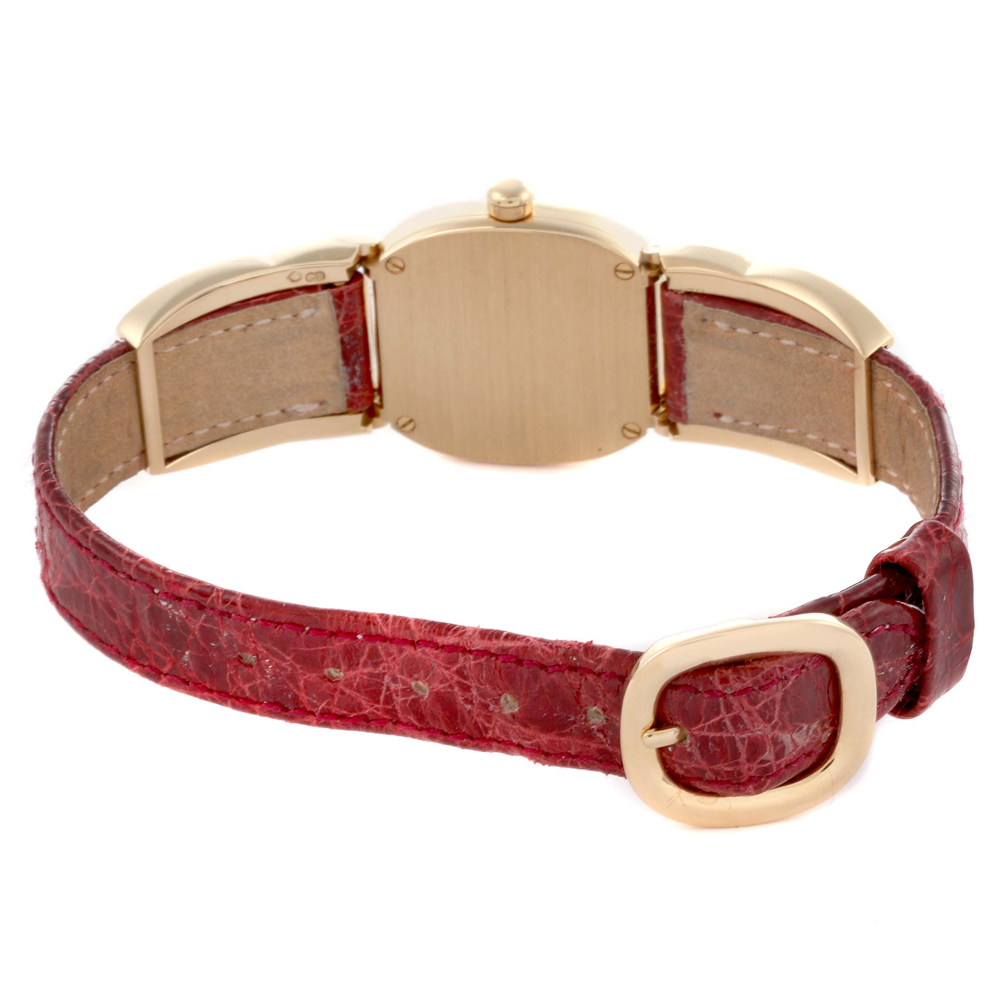 The image shows the back of the Patek Philippe Golden Ellipse 4830J Women's Yellow Gold Mother of Pearl Dial 4830J Women's Yellow Gold Mother of Pearl Dial watch, focusing on the case back and red strap with a buckle.