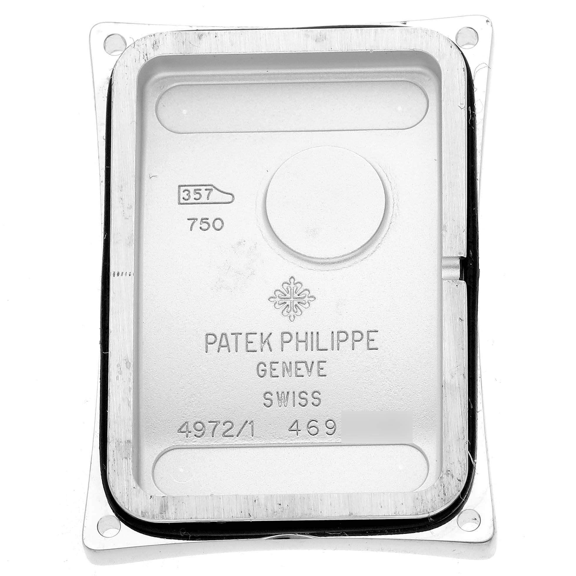 The image shows the inner case back of a Patek Philippe Gondolo 4972/1G-001 Women's White Gold Mother of Pearl Dial 4972/1G-001 Women's White Gold Mother of Pearl Dial watch with engravings and hallmark details.