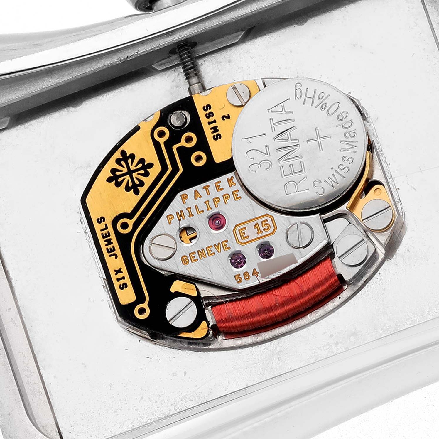 The image shows an internal view of the Patek Philippe Gondolo 4972/1G-001 Women's White Gold Mother of Pearl Dial 4972/1G-001 Women's White Gold Mother of Pearl Dial watch, highlighting its movement and components.