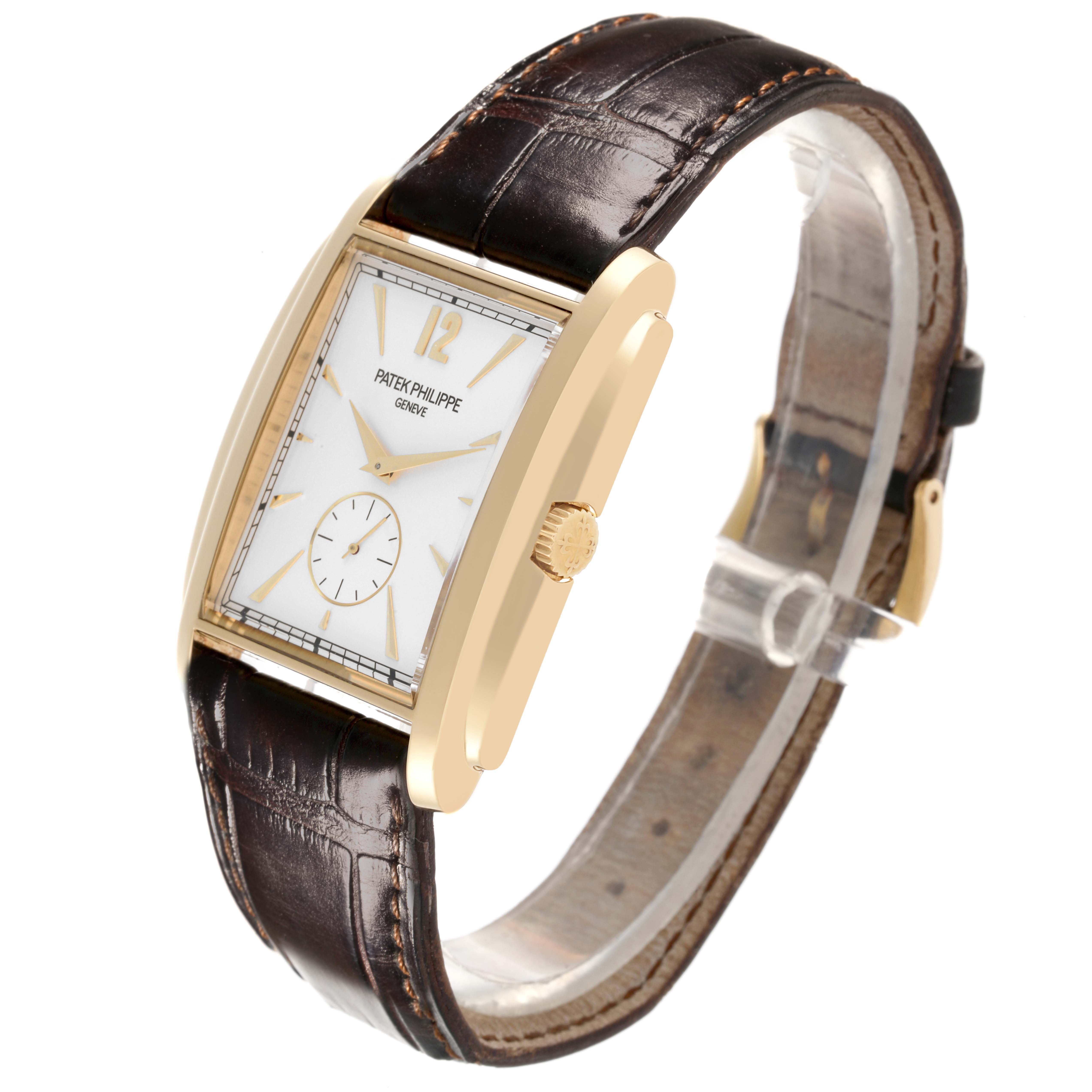 The Patek Philippe Gondolo 5124J Men's Yellow Gold Silver Dial 5124J Men's Yellow Gold Silver Dial watch is shown from a side angle, highlighting the face, case, and leather strap.