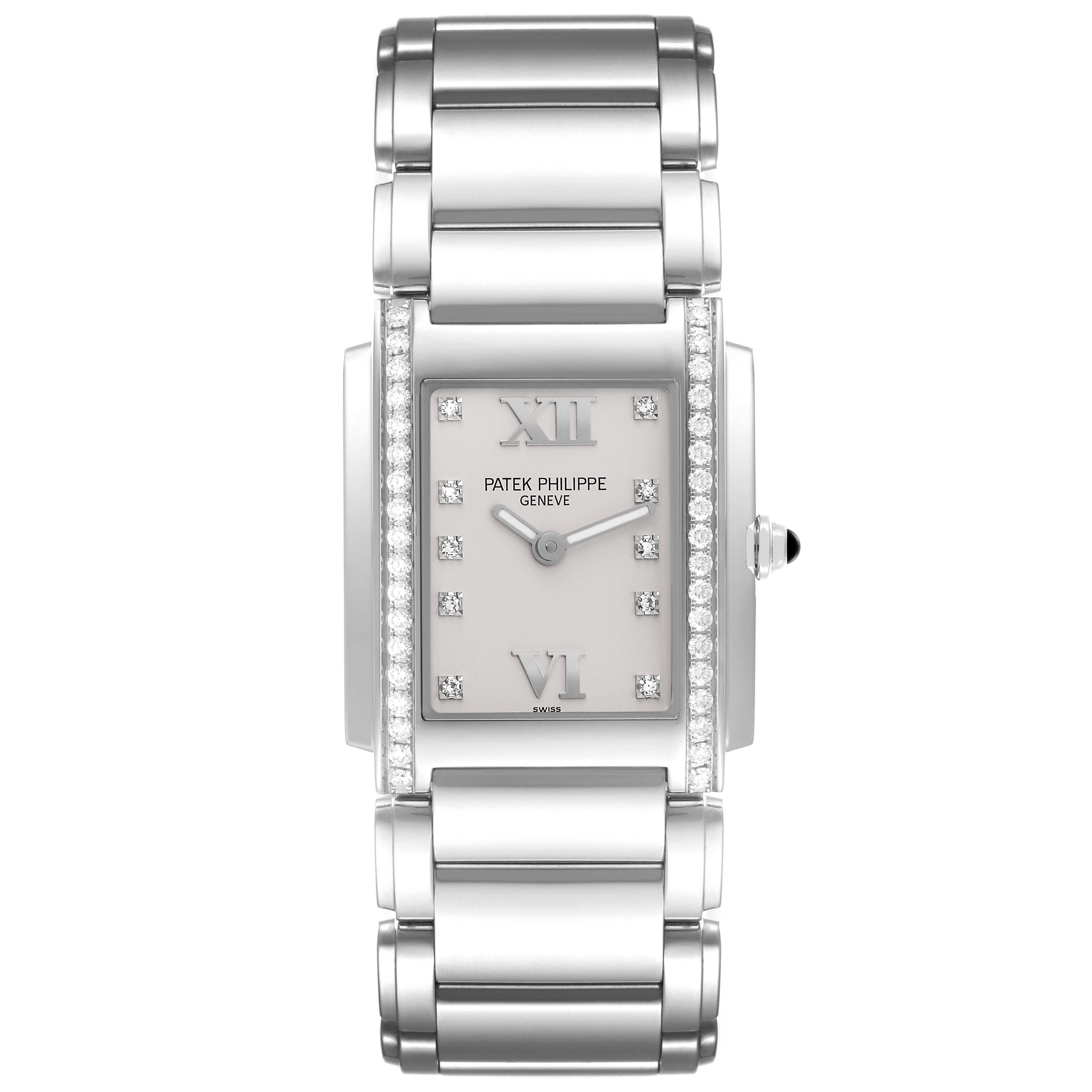 The image shows a top-down view of a Patek Philippe Twenty-4 4910/10A-011 Women's Stainless Steel Silver Dial 4910/10A-011 Women's Stainless Steel Silver Dial watch, highlighting its rectangular face and diamond accents.