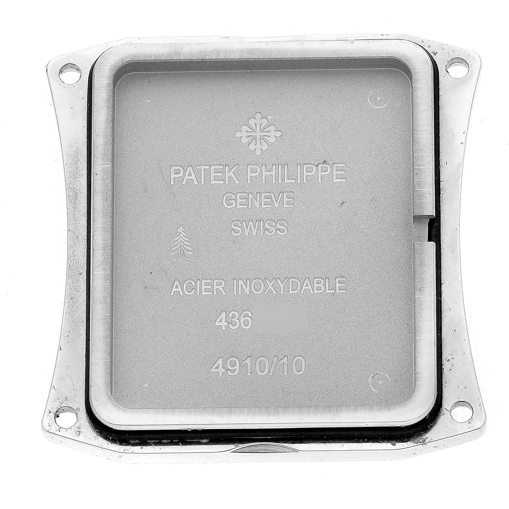 The image shows the case back of a Patek Philippe Twenty-4 4910/10A-011 Women's Stainless Steel Silver Dial 4910/10A-011 Women's Stainless Steel Silver Dial watch, highlighting engraving details.
