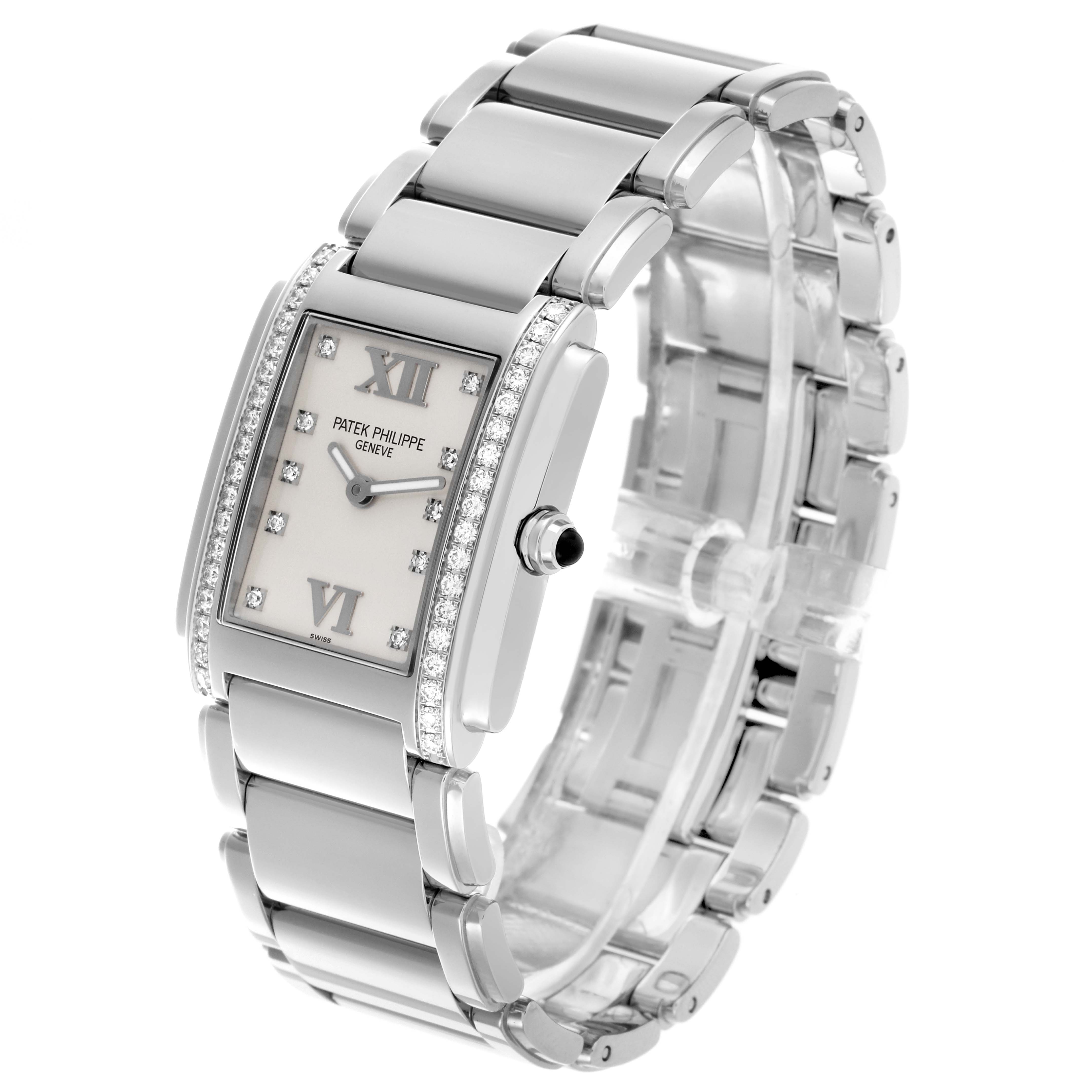 The image shows a Patek Philippe Twenty-4 4910/10A-011 Women's Stainless Steel Silver Dial 4910/10A-011 Women's Stainless Steel Silver Dial watch angled to display the face, bezel, and stainless steel bracelet.