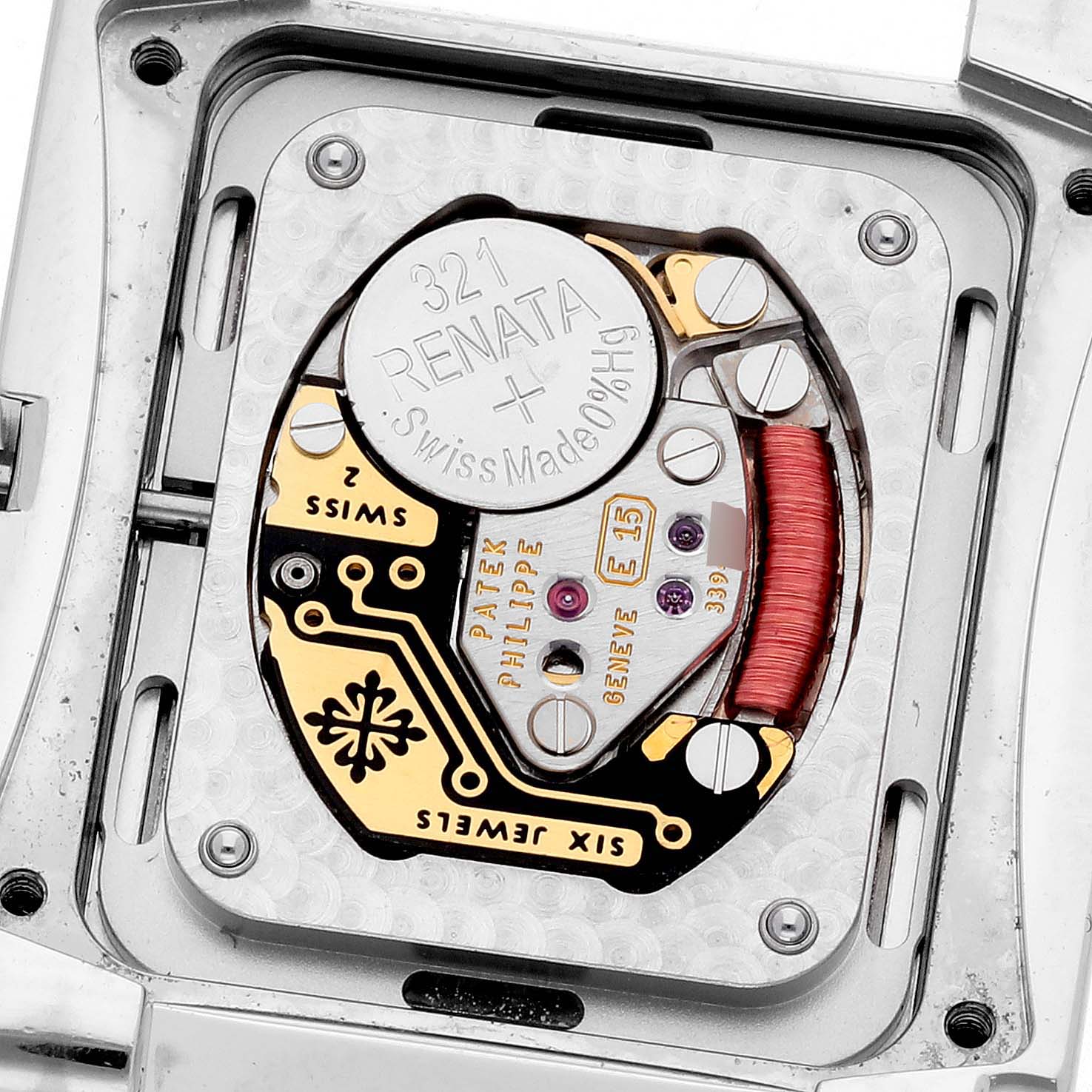 The image shows the back view of a Patek Philippe Twenty-4 4910/10A-011 Women's Stainless Steel Silver Dial 4910/10A-011 Women's Stainless Steel Silver Dial watch, highlighting its battery and mechanical components.