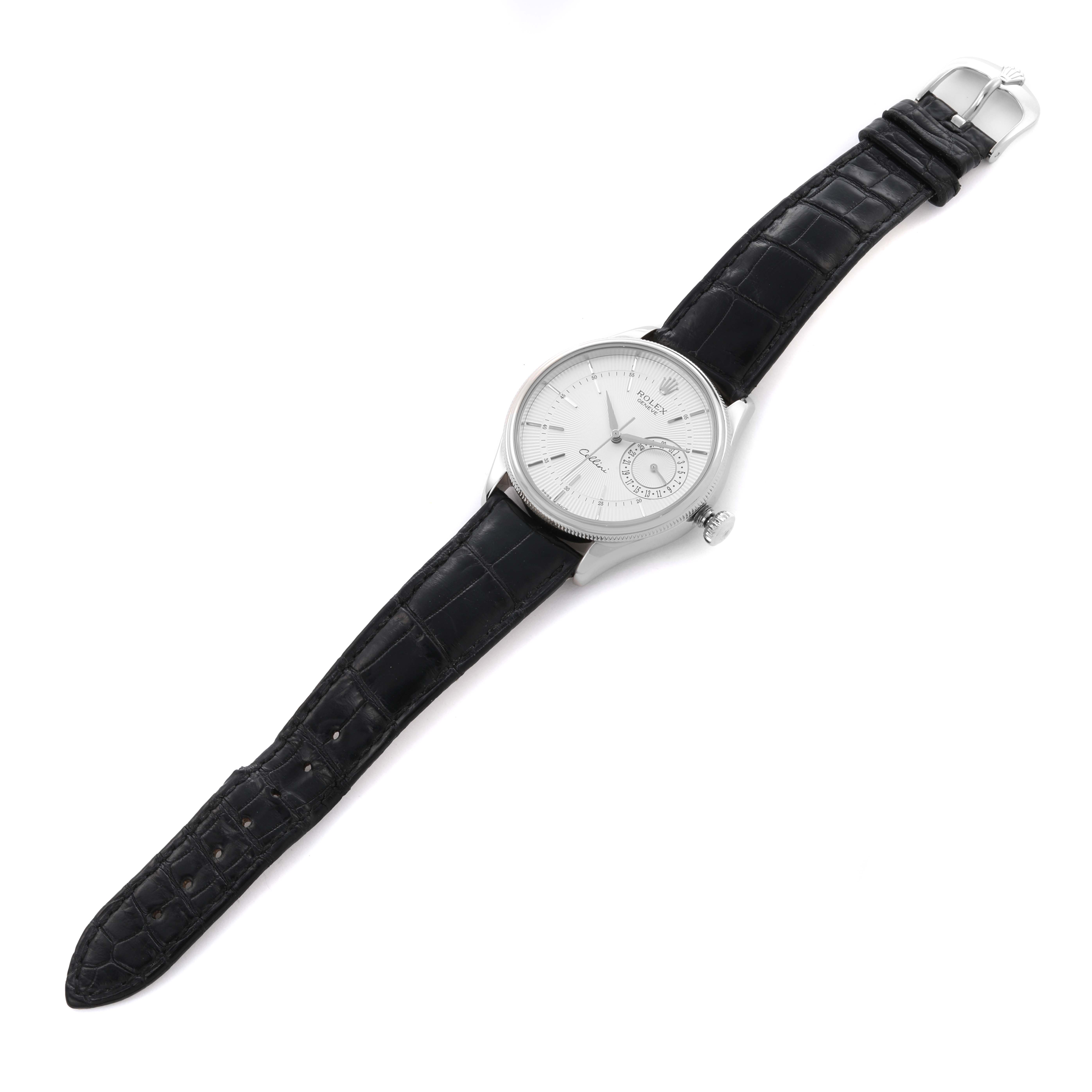 The Rolex Cellini 50519 Men
s White Gold Silver Dial 50519 Men
s White Gold Silver Dial watch is shown from an angled top view, displaying its dial, leather strap, and buckle.