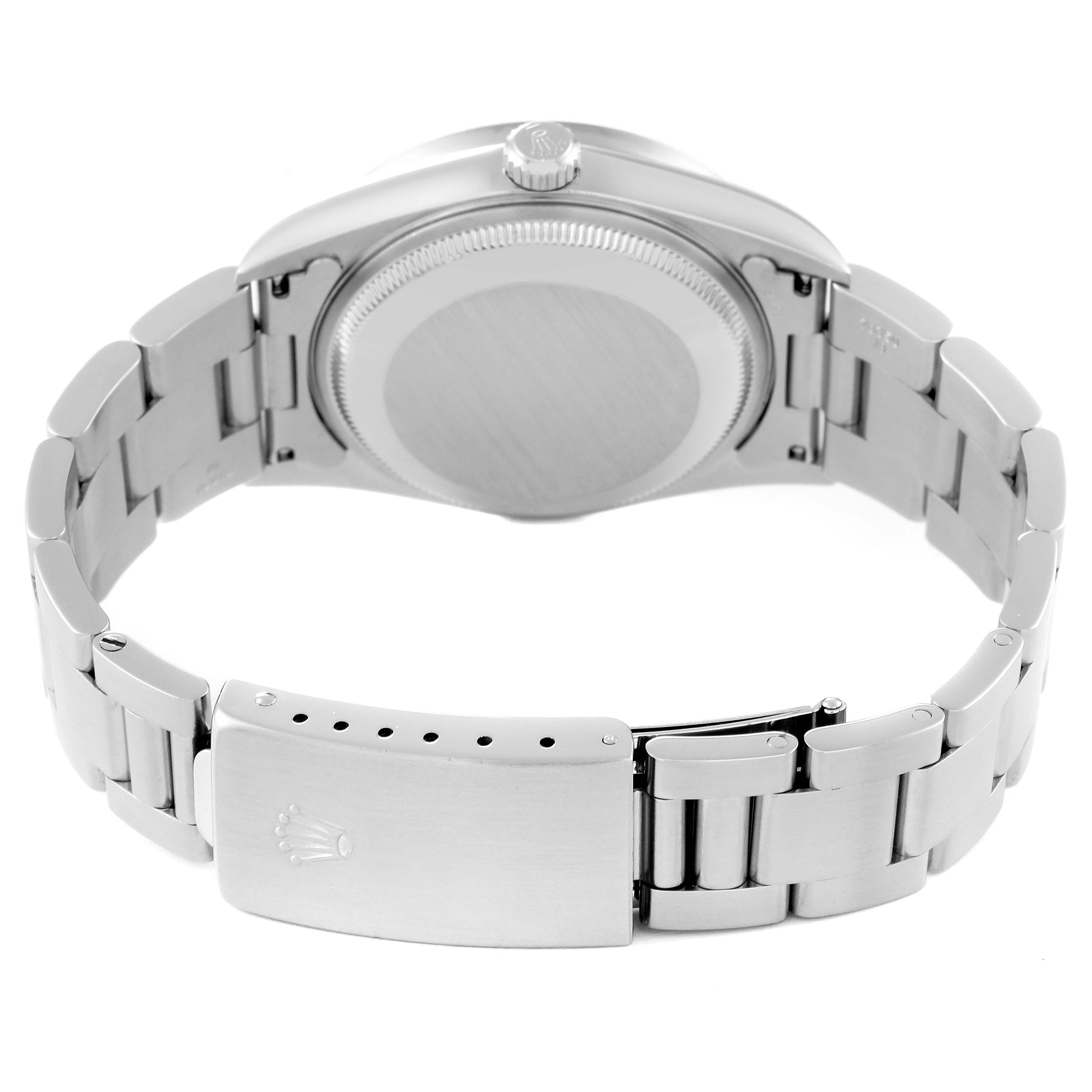 The image shows the back view of a Rolex Date 15210 Men's Stainless Steel Black Dial 15210 Men's Stainless Steel Black Dial model watch, displaying the case back and bracelet with the clasp open.