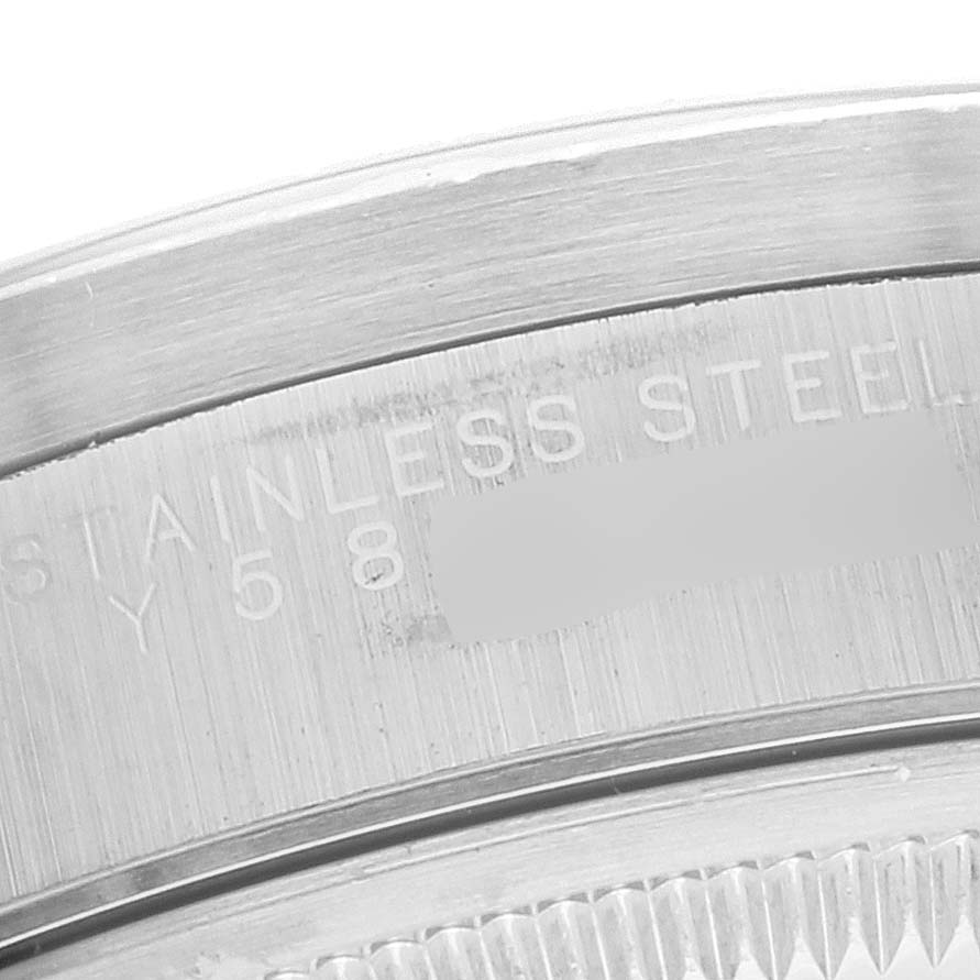This image shows a close-up angle of the case back and serial number engraving on a Rolex Date 15210 Men's Stainless Steel Black Dial 15210 Men's Stainless Steel Black Dial model watch.