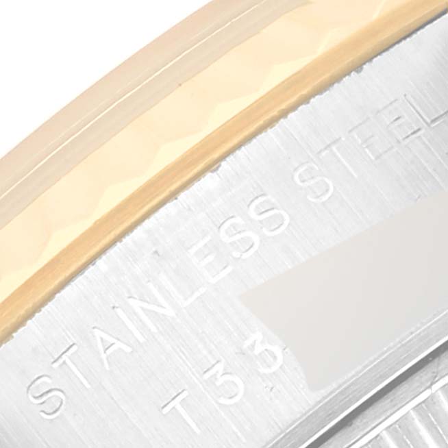 This is a close-up of the side of a Rolex Datejust 69173 Women's Steel and Gold (two tone) Champagne Dial 69173 Women's Steel and Gold (two tone) Champagne Dial model, showing the stainless steel engraving and part of the bezel.