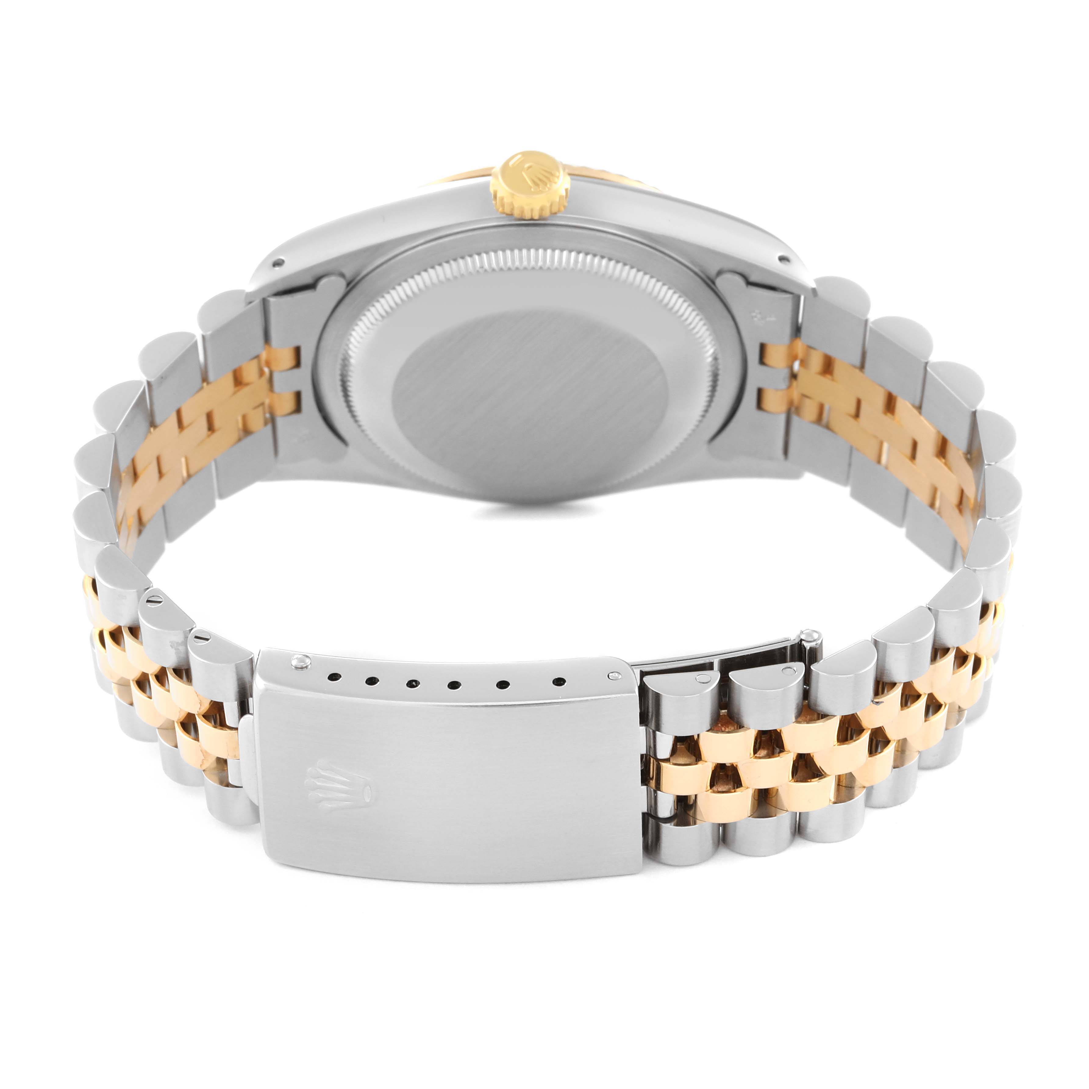 This image shows the case back and bracelet, including the clasp, of a Rolex Datejust 16233 Men's Steel and Gold (two tone) Champagne Dial 16233 Men's Steel and Gold (two tone) Champagne Dial watch viewed from the back.