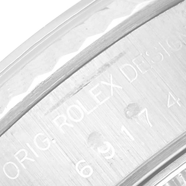 This close-up image shows the engraved inner bezel of a Rolex Datejust 69174 Women's Stainless Steel Silver Dial 69174 Women's Stainless Steel Silver Dial watch.