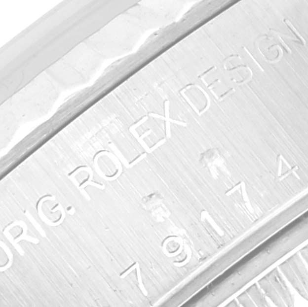 This image shows a close-up of the engraved inner bezel of a Rolex Datejust 79174 Women's Stainless Steel Mother of Pearl Dial 79174 Women's Stainless Steel Mother of Pearl Dial watch.