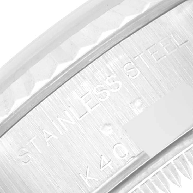 The image shows a close-up of the engraved text on the stainless steel case back of a Rolex Datejust 79174 Women's Stainless Steel Mother of Pearl Dial 79174 Women's Stainless Steel Mother of Pearl Dial watch.