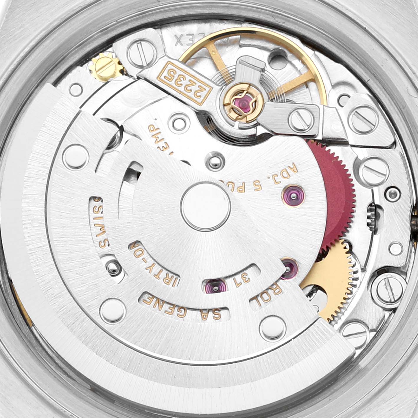 This image shows a close-up view of the movement of a Rolex Datejust 79174 Women's Stainless Steel Mother of Pearl Dial 79174 Women's Stainless Steel Mother of Pearl Dial watch, highlighting the intricate gears and rotor.