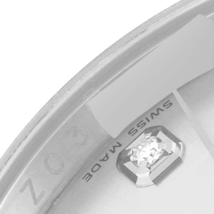 The image shows a close-up of the bezel and part of the dial of a Rolex Datejust 116234 Men's Stainless Steel Silver Dial 116234 Men's Stainless Steel Silver Dial watch, featuring the "Swiss Made" marking and a diamond marker.