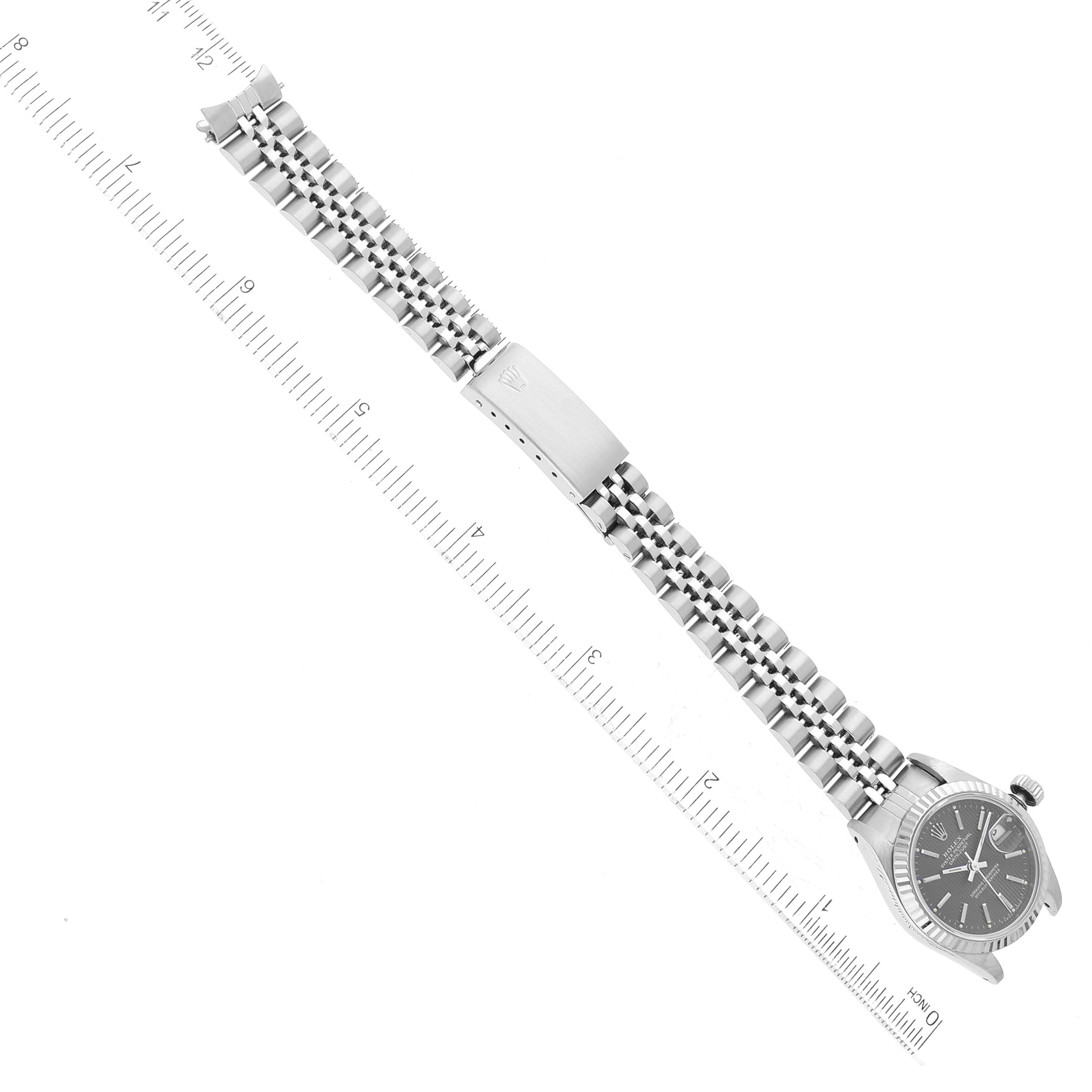 The image shows a Rolex Datejust 69174 Women's Stainless Steel Grey Dial 69174 Women's Stainless Steel Grey Dial watch from a top-down angle, displaying the dial, bezel, bracelet, and clasp.