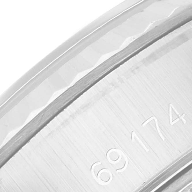 This is a close-up view of the bezel and part of the case back of a Rolex Datejust 69174 Women's Stainless Steel Grey Dial 69174 Women's Stainless Steel Grey Dial model.