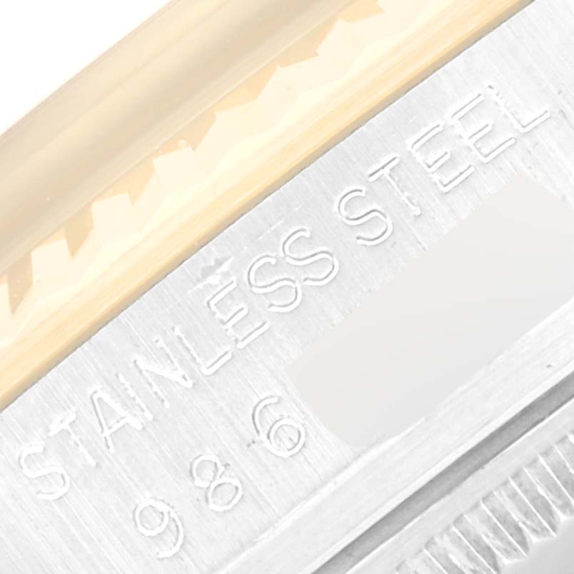 This close-up image shows the stainless steel part of the Rolex Vintage Collection 16013 Men's Steel and Gold (two tone) Burgundy Dial 16013 Men's Steel and Gold (two tone) Burgundy Dial watch, highlighting its engraved text.