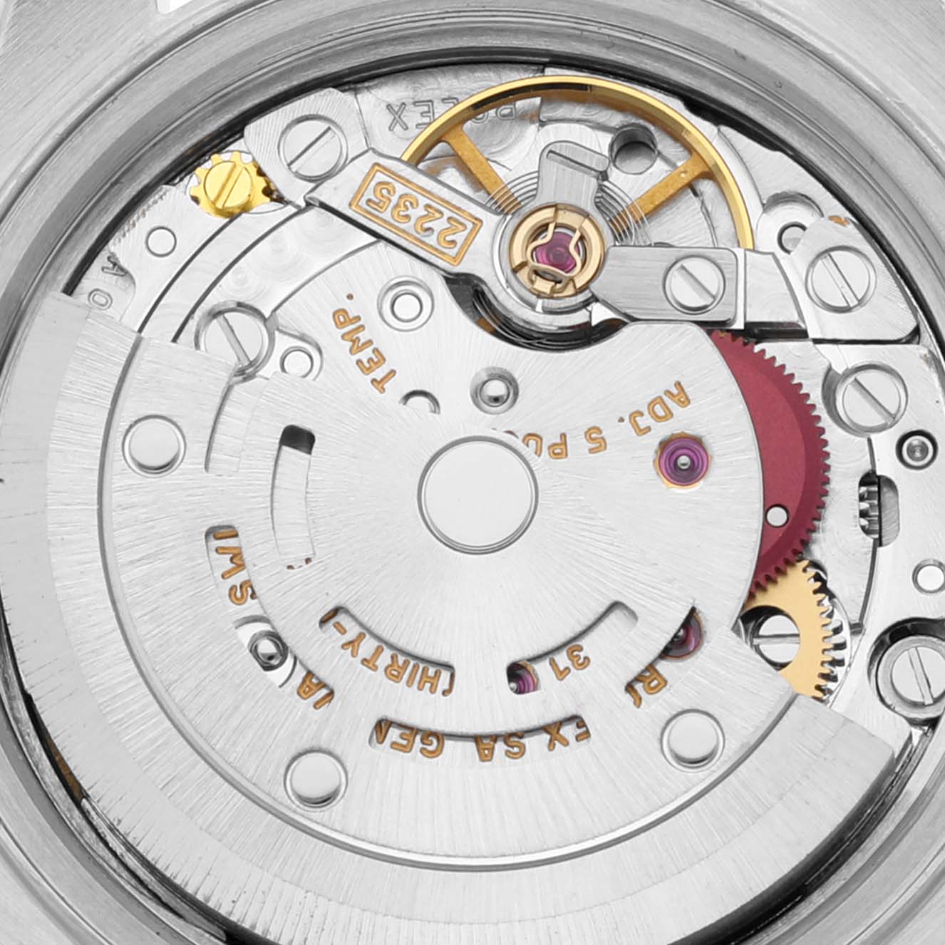 This image shows the internal mechanism and intricate components of a Rolex Datejust 79173 Women's Steel and Gold (two tone) White Dial 79173 Women's Steel and Gold (two tone) White Dial watch at a close-up angle.