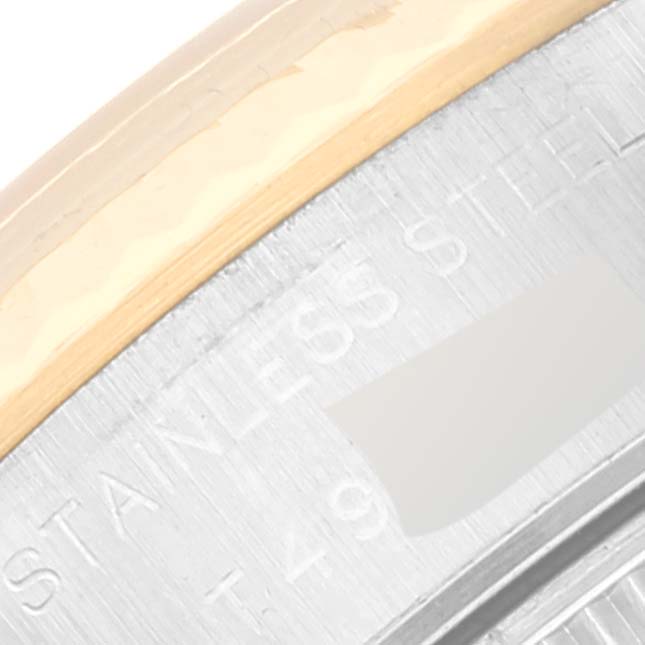 This close-up shows the "Rolex Datejust 69173 Women's Steel and Gold (two tone) White Dial 69173 Women's Steel and Gold (two tone) White Dial" and "STAINLESS STEEL" engravings on the side of the watch case.