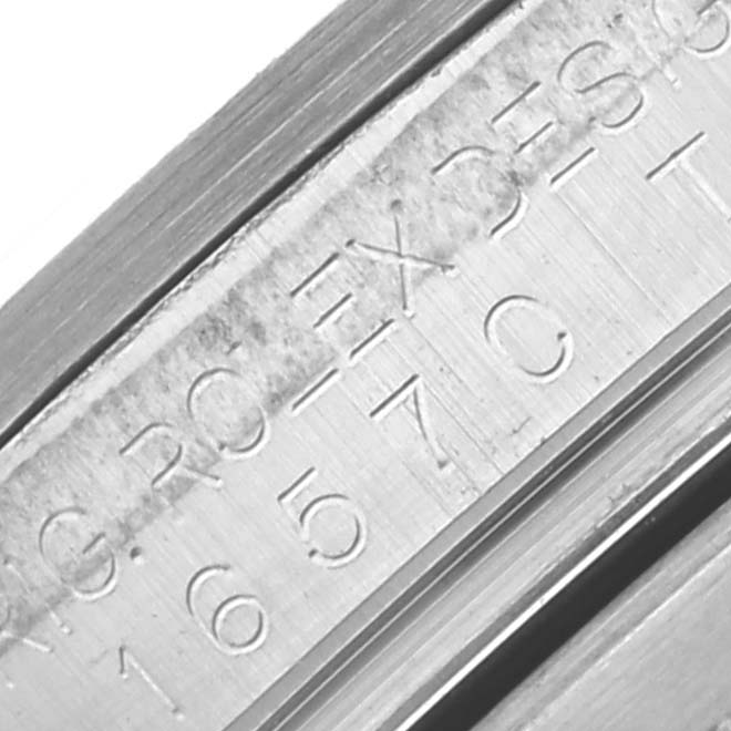 The image shows a close-up of the engraved inner bezel of a Rolex Explorer 16570 Men's Stainless Steel White Dial 16570 Men's Stainless Steel White Dial watch.