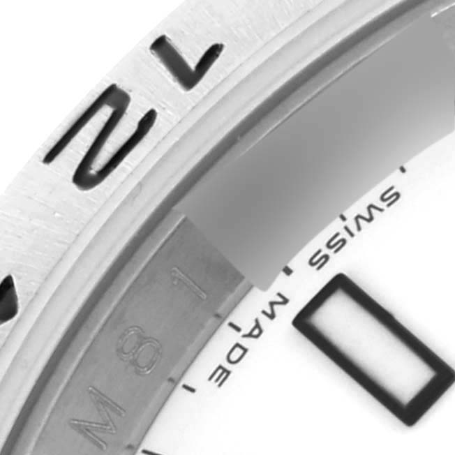 The image shows a partial close-up of the bezel and dial edge on a Rolex Explorer 16570 Men's Stainless Steel White Dial 16570 Men's Stainless Steel White Dial watch, highlighting the numerals and "Swiss Made."