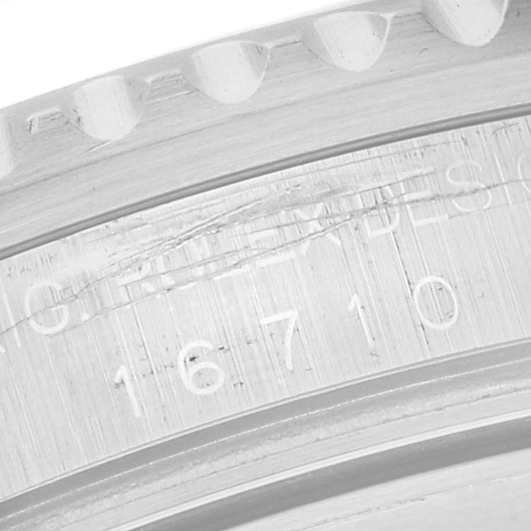 This close-up image shows the reference number "16710" engraved on the case side of a Rolex GMT-Master 16710 Men
s Stainless Steel Black Dial 16710 Men
s Stainless Steel Black Dial watch.