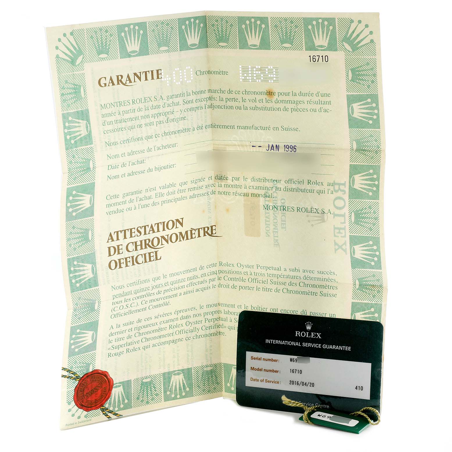 The image shows warranty and chronometer certification papers for a Rolex GMT-Master 16710 Men
s Stainless Steel Black Dial 16710 Men
s Stainless Steel Black Dial model, along with an international service guarantee card.