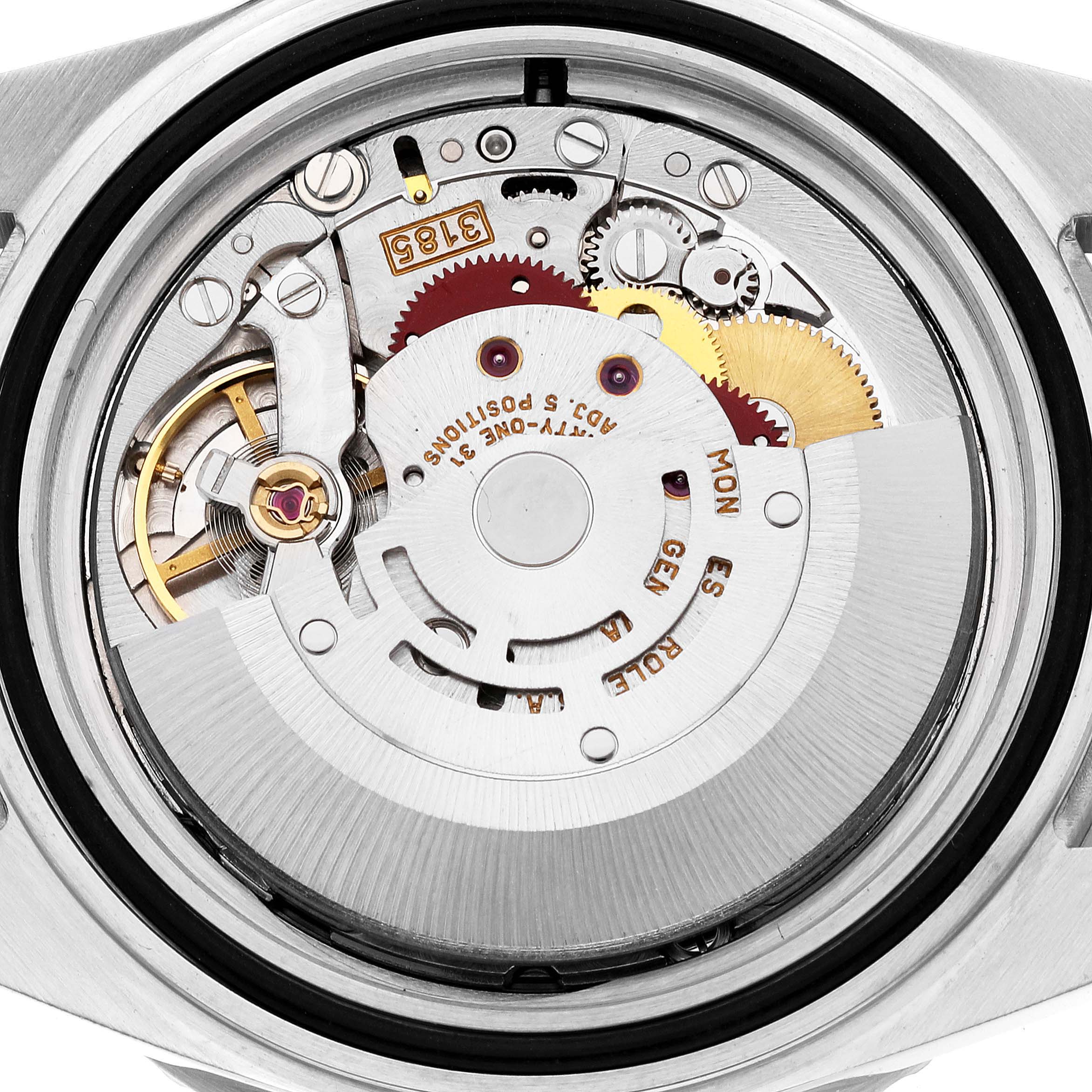 The image shows an overhead view of the movement inside a Rolex GMT-Master 16710 Men
s Stainless Steel Black Dial 16710 Men
s Stainless Steel Black Dial watch, highlighting its intricate mechanical components.