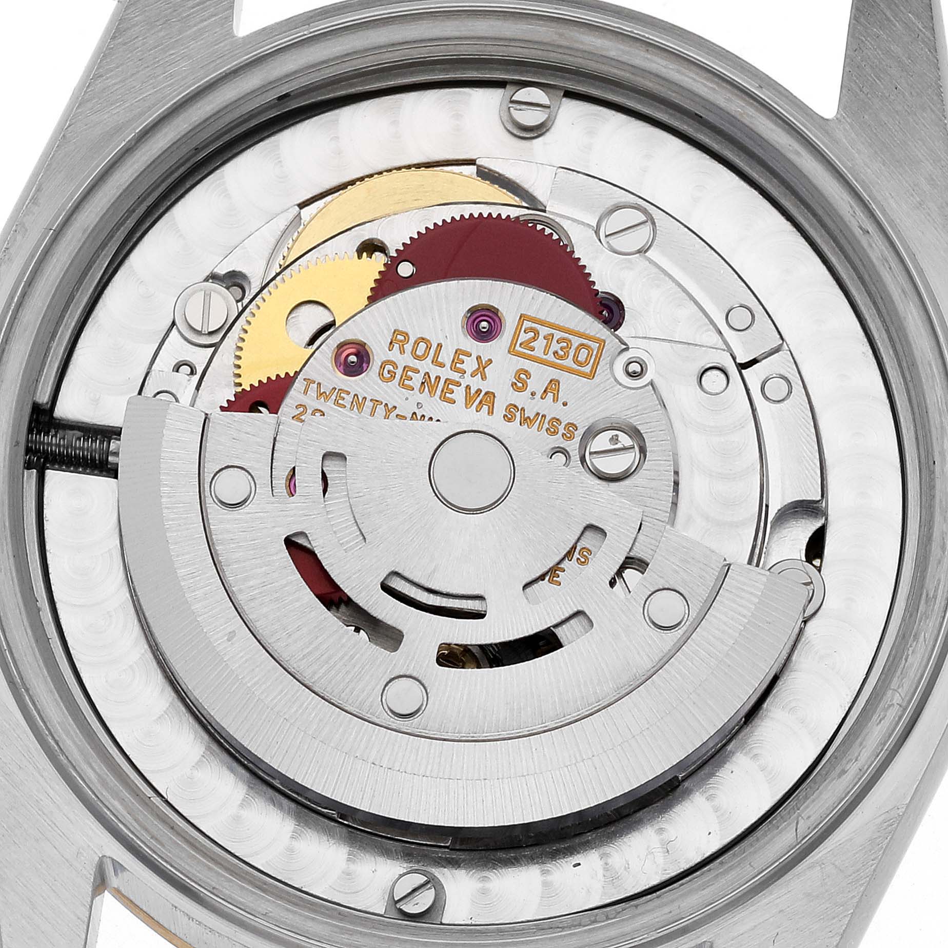 This image shows a close-up of the movement inside a Mid-Size Rolex watch, revealing the intricate mechanism and components.