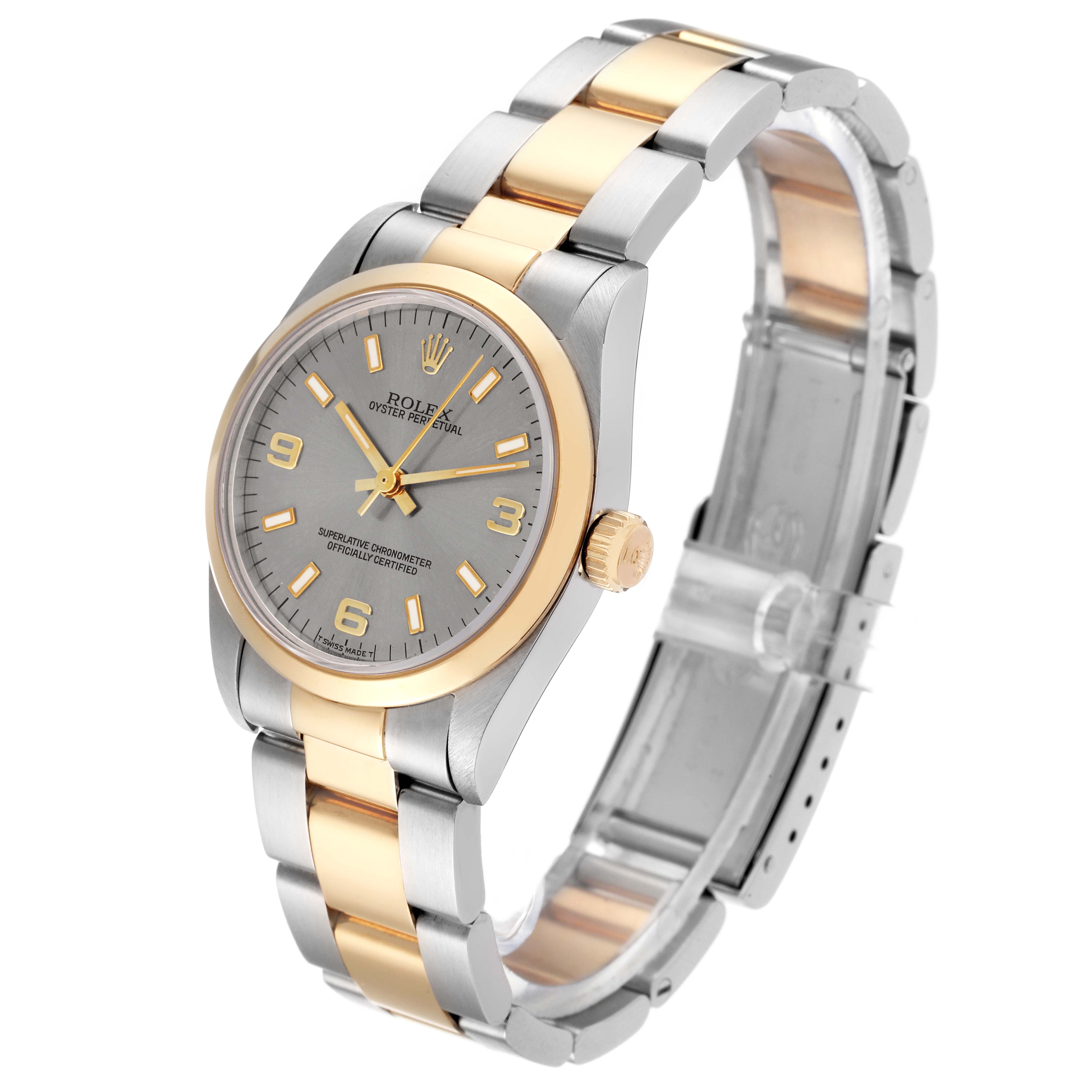 This image shows a Rolex Mid-Size 67483 Women's Steel and Gold (two tone) Grey Dial 67483 Women's Steel and Gold (two tone) Grey Dial Oyster Perpetual watch, viewed at an angle highlighting the watch face, bezel, and two-tone bracelet.
